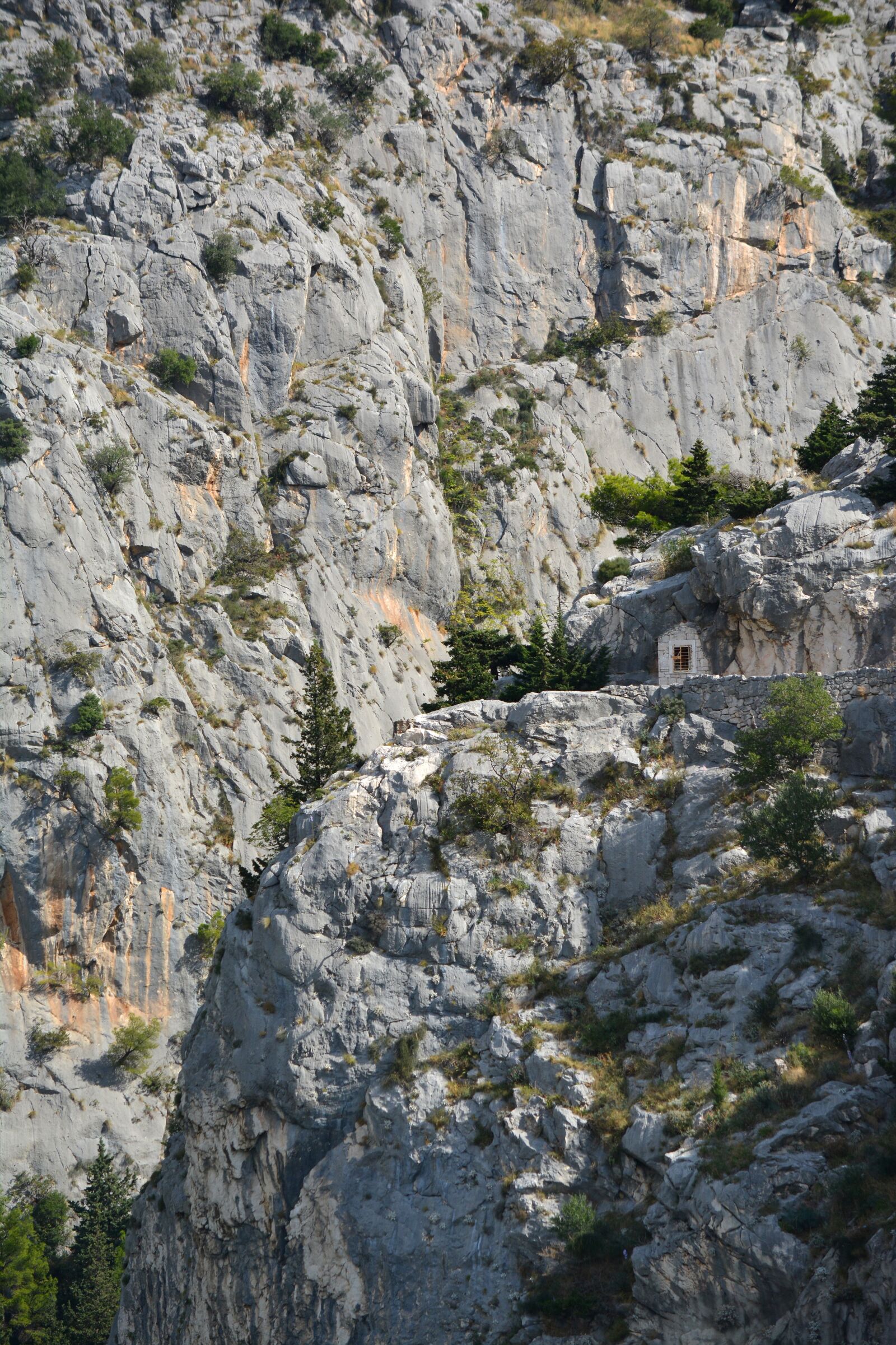 Nikon D5200 sample photo. House in rock, cliff photography