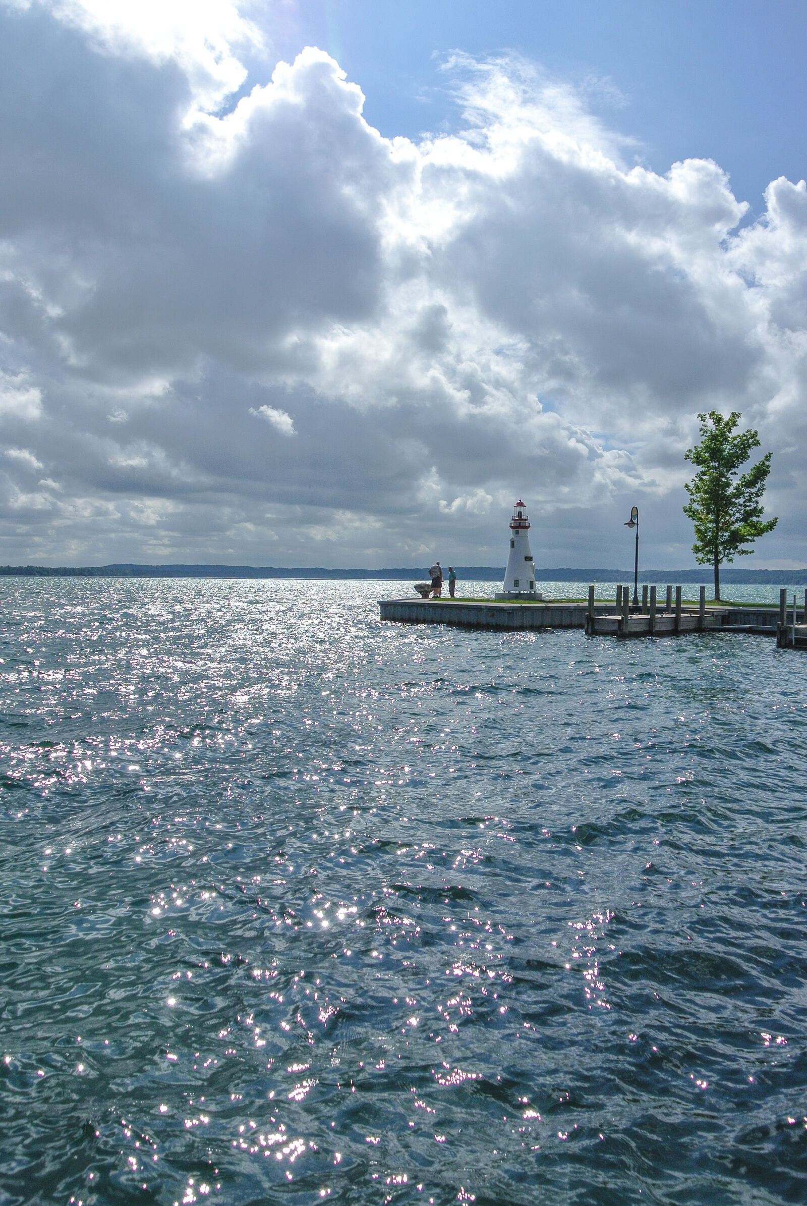 Nikon 1 Nikkor VR 10-30mm F3.5-5.6 sample photo. Boat, launch, clouds, lake photography