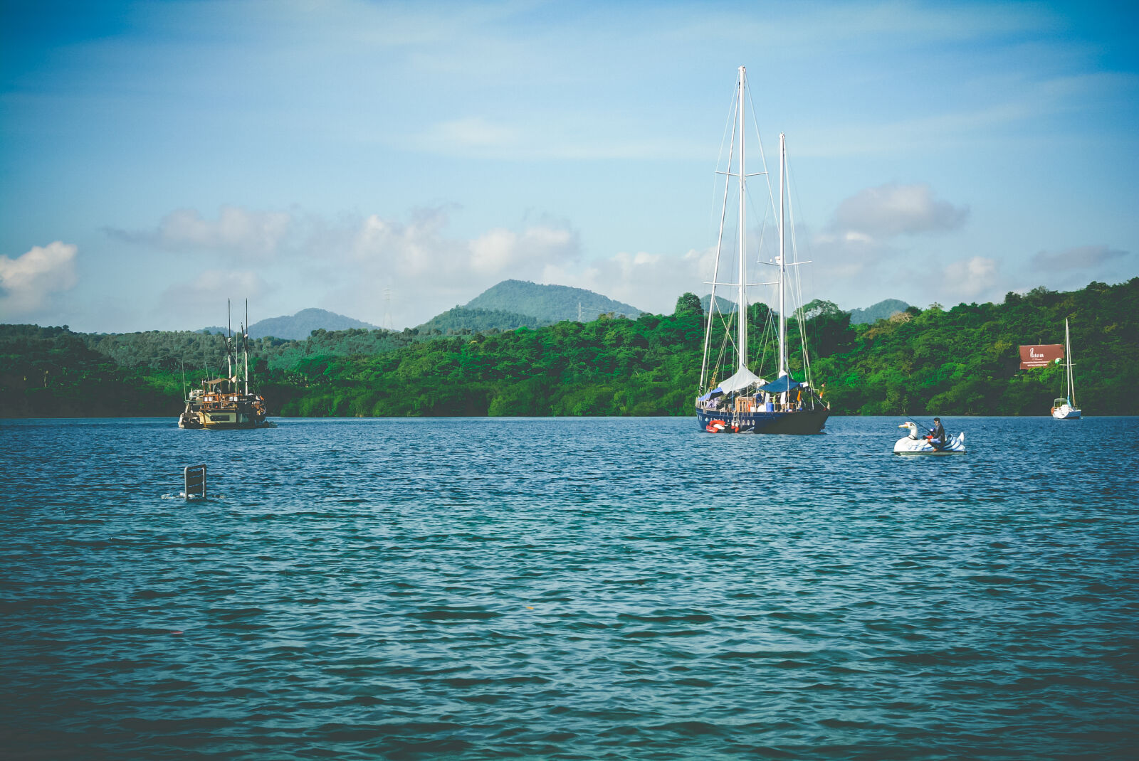 Nikon D5200 sample photo. Beach, boat, calm, waters photography