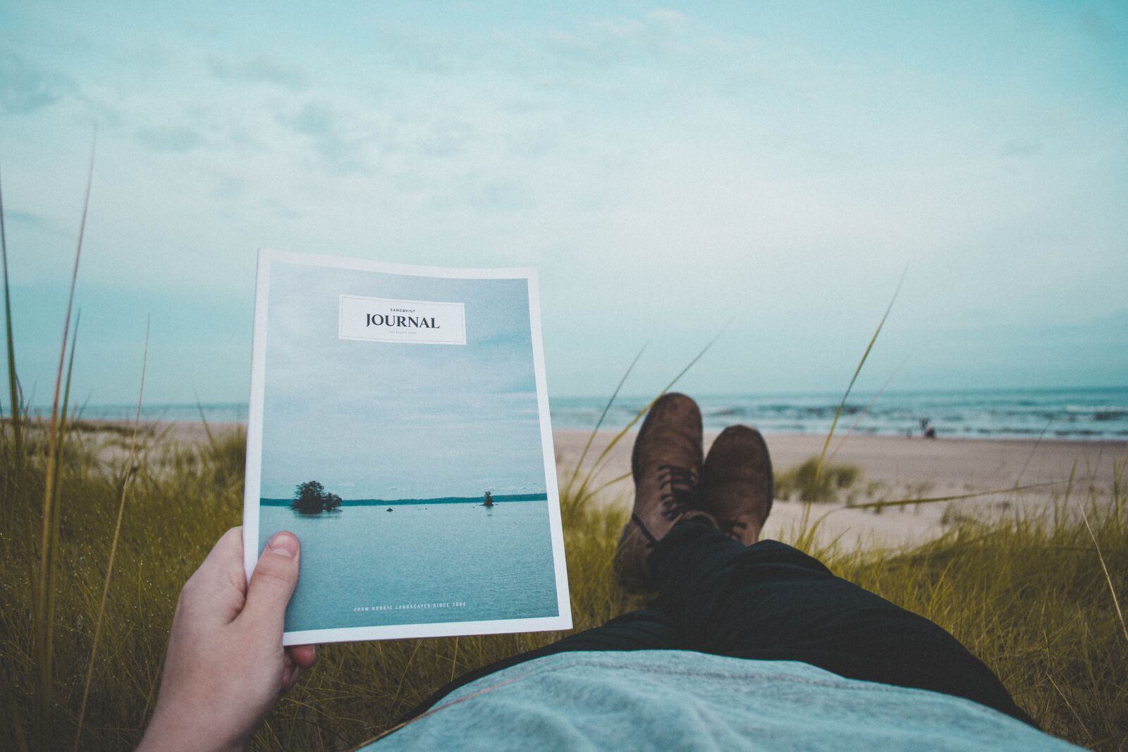 Nikon D3100 sample photo. Beach, hand, journal photography