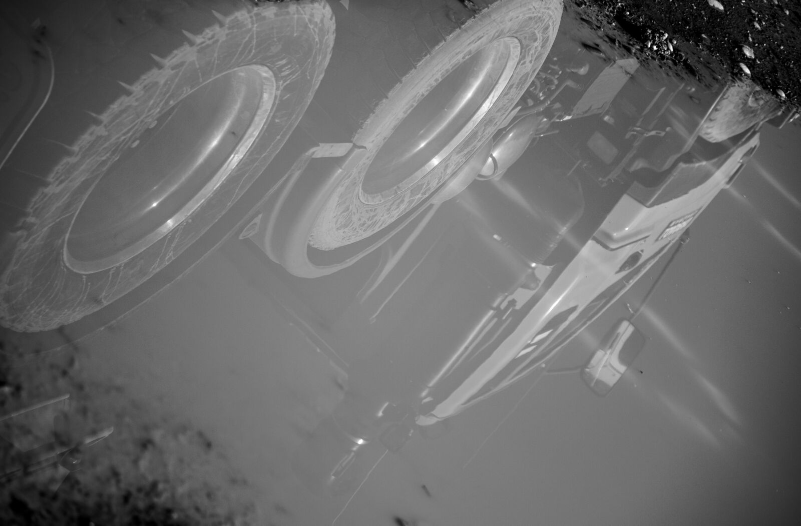 Canon EF-S 55-250mm F4-5.6 IS sample photo. Construction, dirty, reflection, truck photography