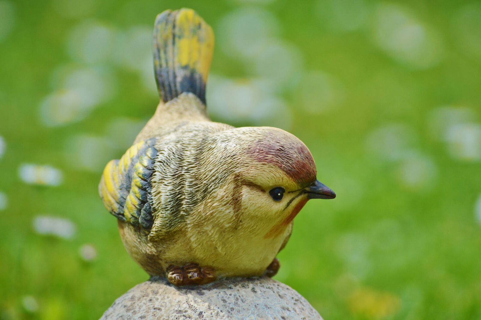 Nikon D3200 sample photo. Bird, sculpture, stone photography