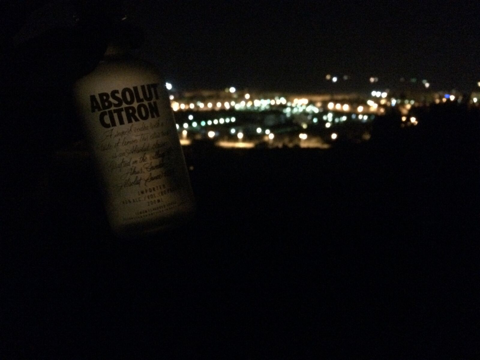iPhone 5s back camera 4.15mm f/2.2 sample photo. Absolut, alcohol, bottles, city photography