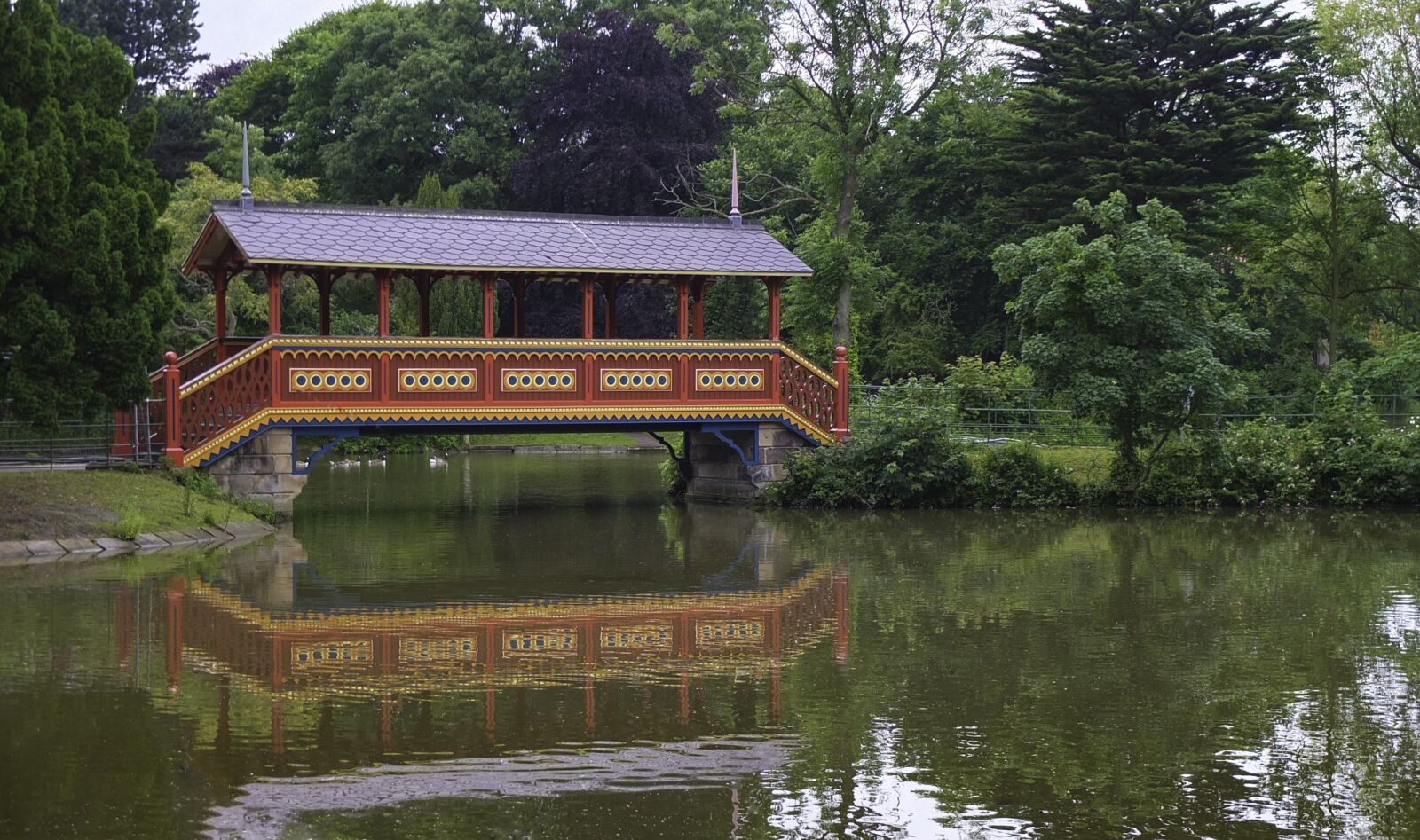 Fujifilm X10 sample photo. Water, marquee, tree photography