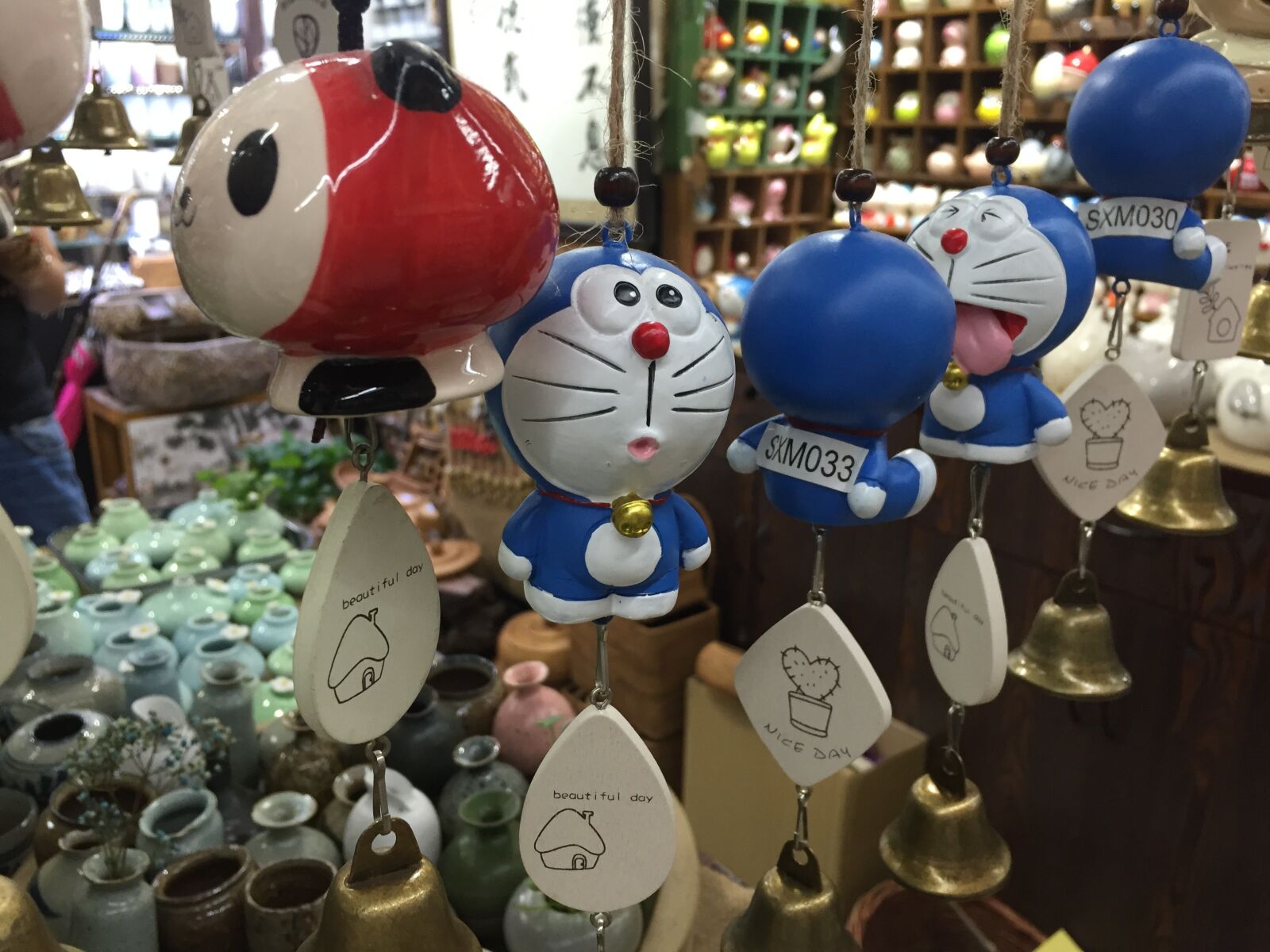 Apple iPhone 6 sample photo. Doraemon, manga, wind chimes photography