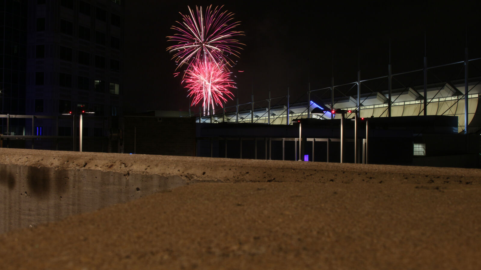 Canon EOS 700D (EOS Rebel T5i / EOS Kiss X7i) + Canon EF 24-105mm F4L IS USM sample photo. City, dark, distance, fireworks photography