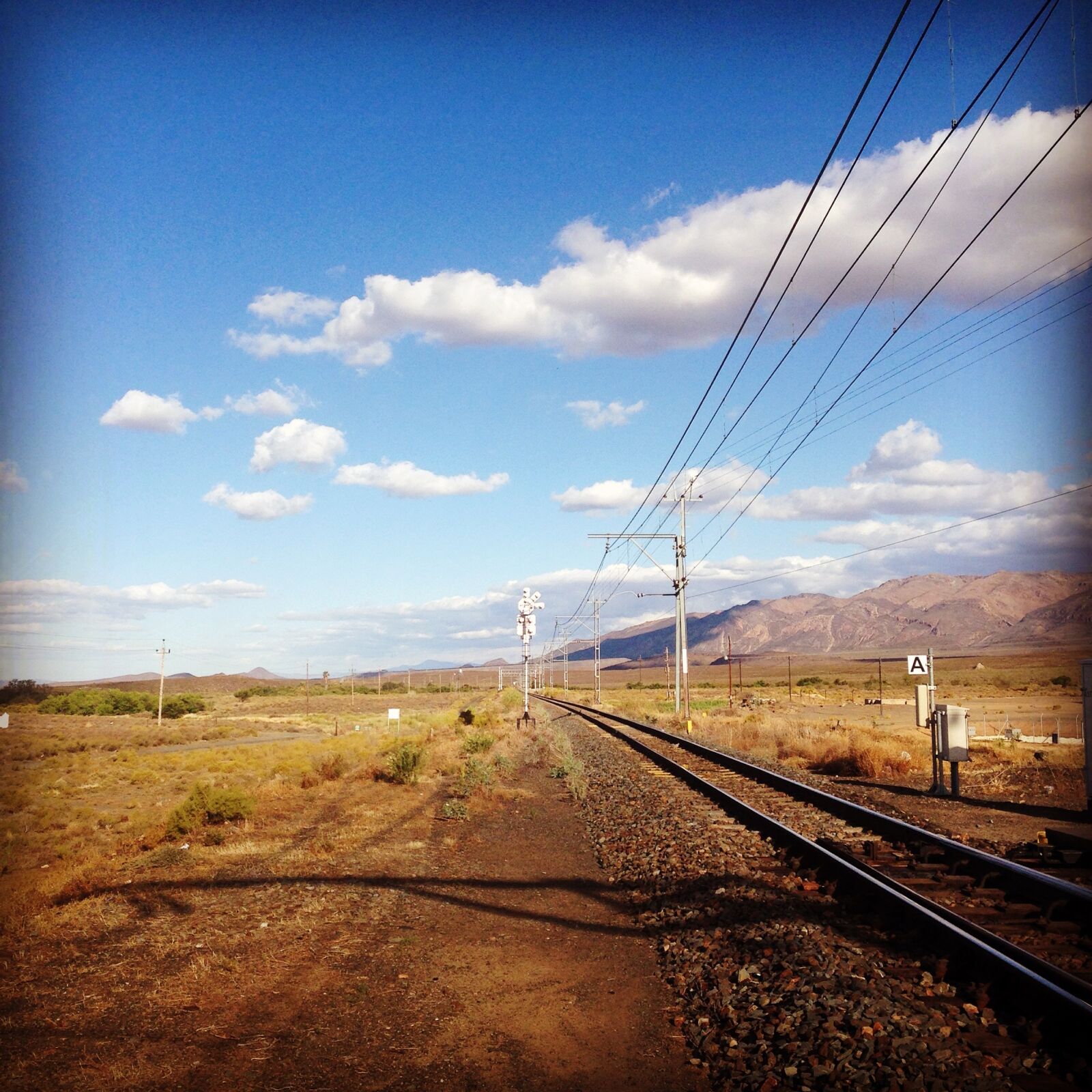iPhone 5 back camera 4.12mm f/2.4 sample photo. Train, sky, clouds photography