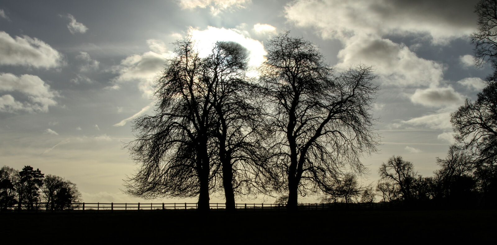 Canon EF 24-105mm F4L IS USM sample photo. Clouds, fence, silhouette, sunshine photography