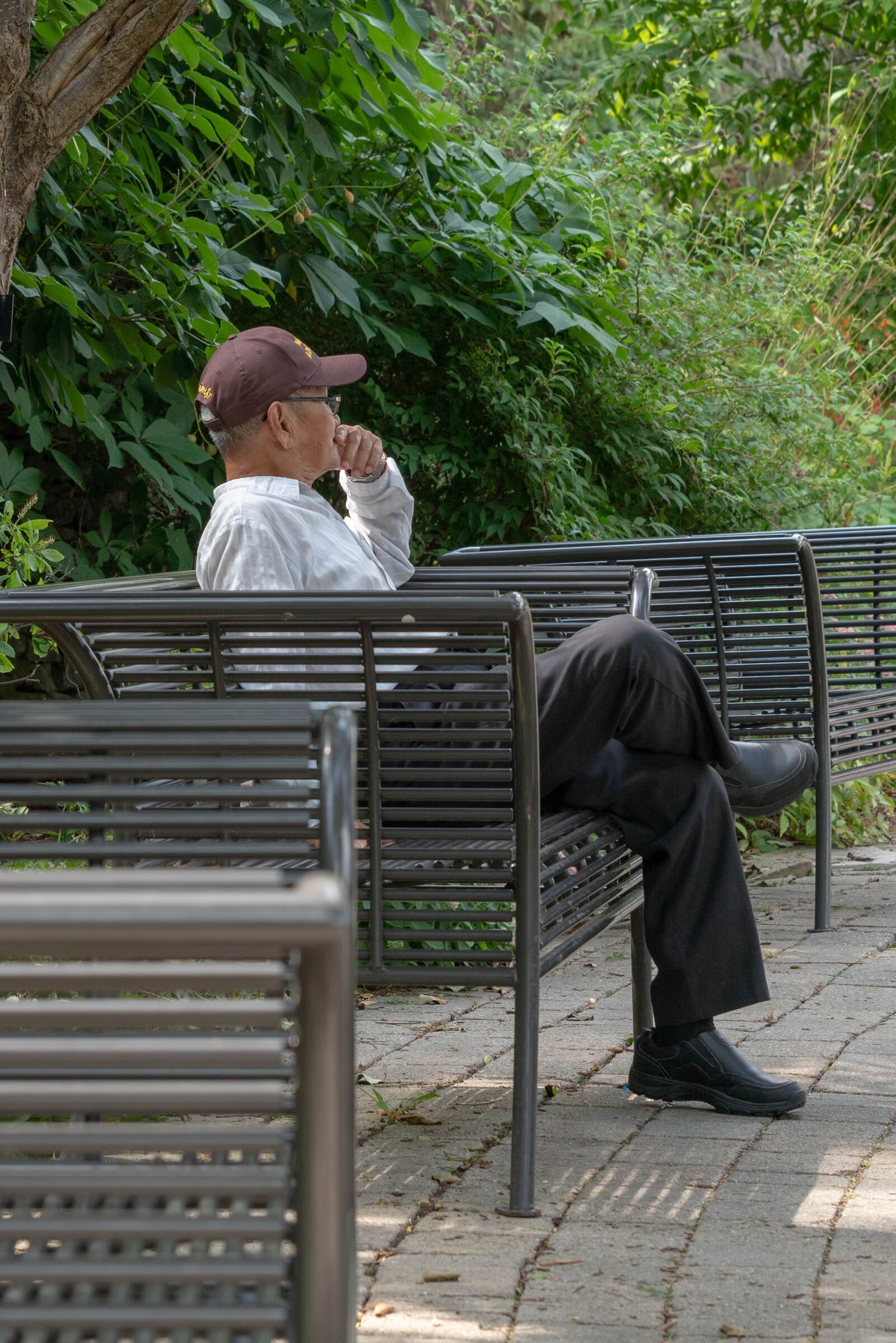 Sony a7R III sample photo. Man sitting on bench photography
