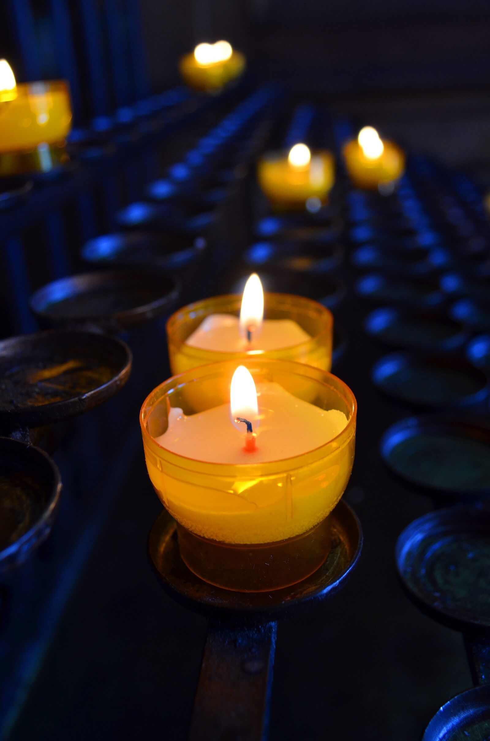Nikon D5100 sample photo. Votive light, church, candle photography