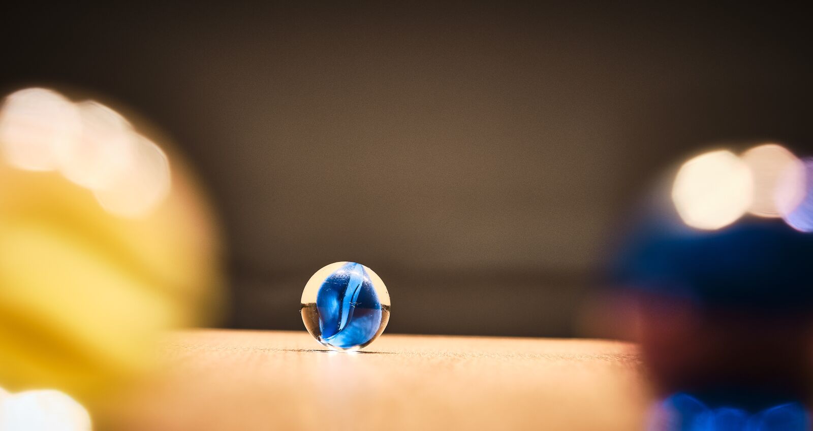 Fujifilm XF 18-55mm F2.8-4 R LM OIS sample photo. Marble, toys, glass photography
