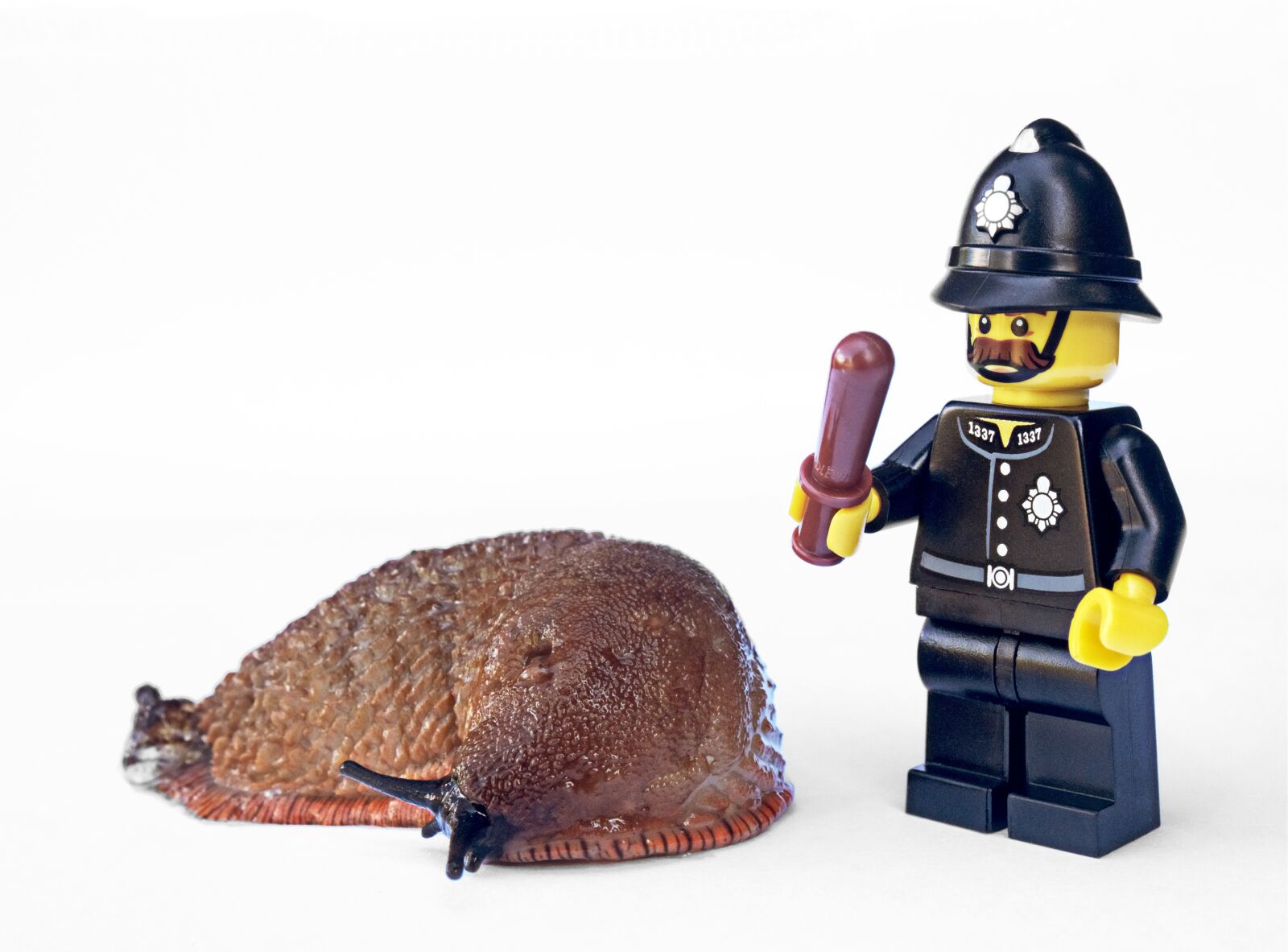 Olympus OM-D E-M5 sample photo. Slug, policeman, lego photography