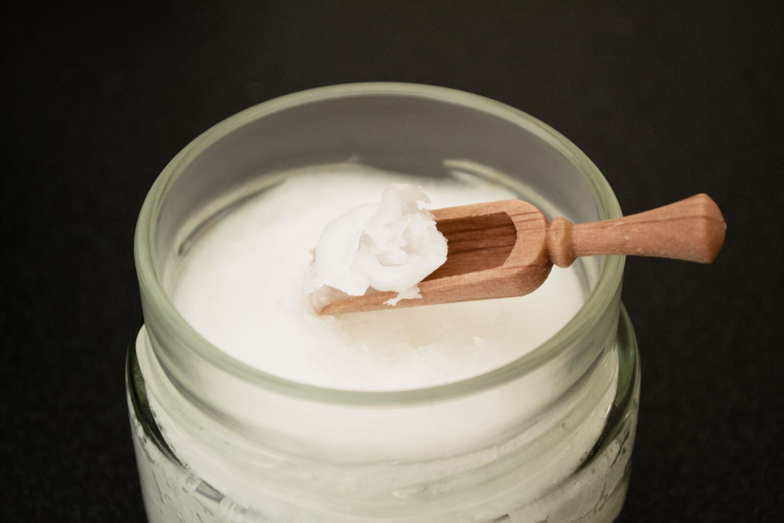 Nikon D3100 sample photo. Coconut oil on wooden photography