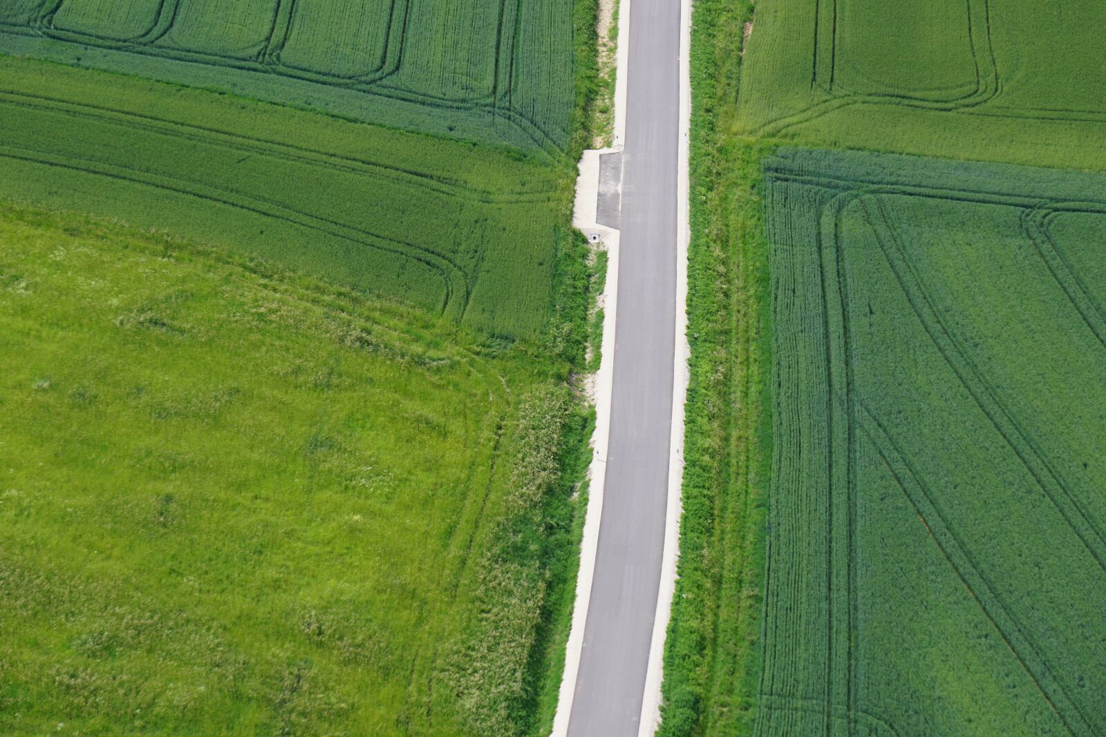 Sony E 55-210mm F4.5-6.3 OSS sample photo. From above, field, road photography