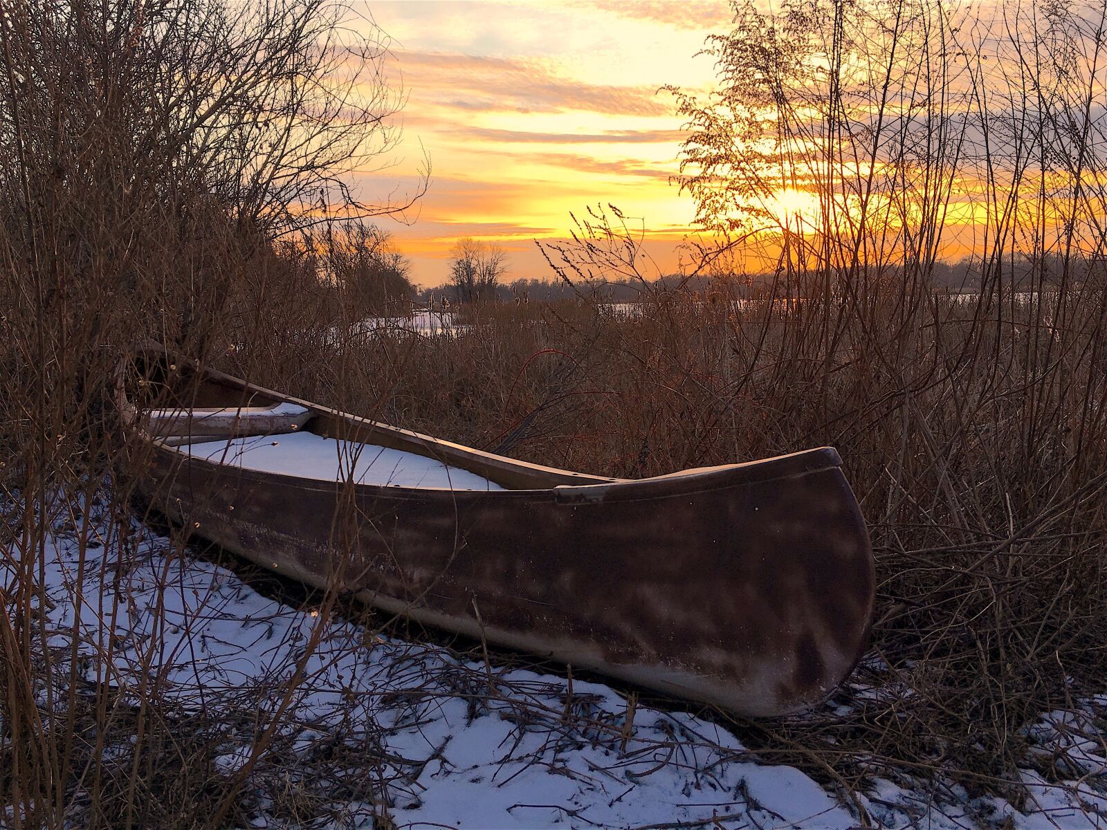 Apple iPhone 6s sample photo. Sunset, canoe, lake photography