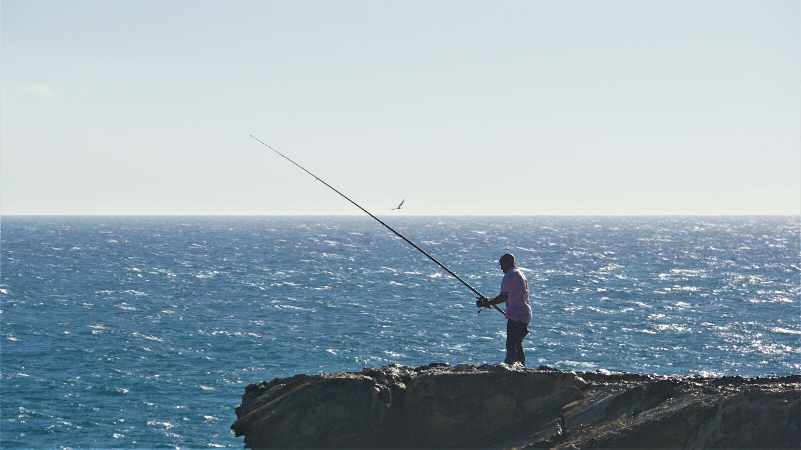 Sony E 18-200mm F3.5-6.3 OSS LE sample photo. Angler, lonely, sea photography