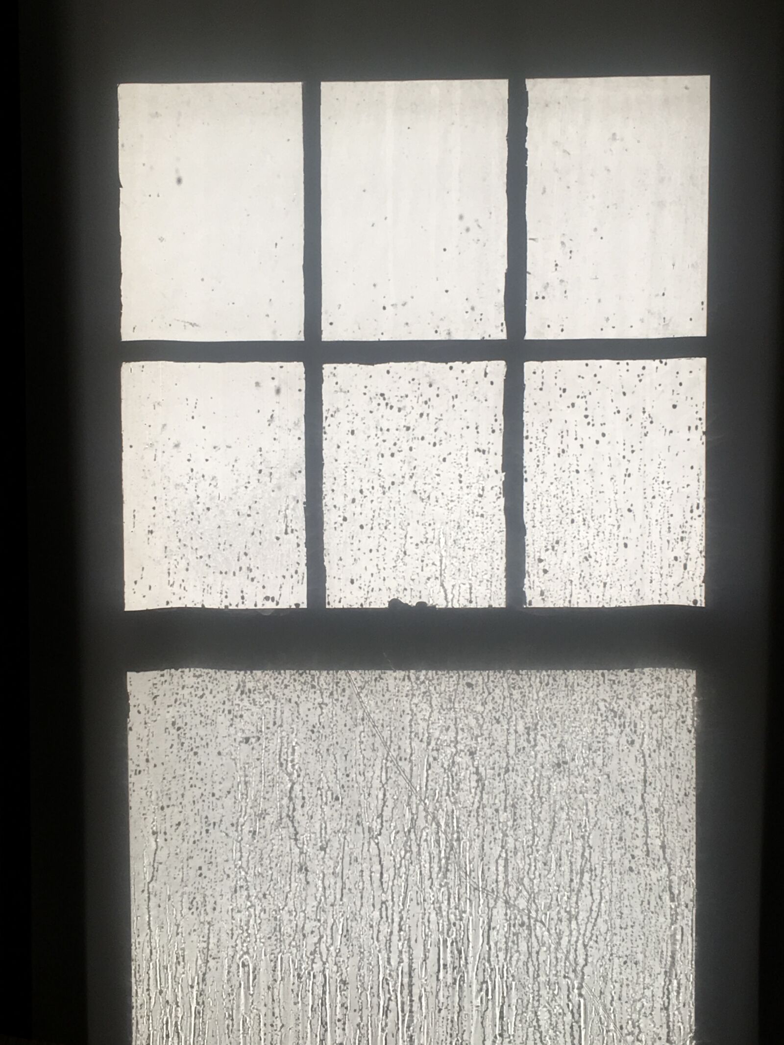 iPhone SE back camera 4.15mm f/2.2 sample photo. Rain, window, black and photography