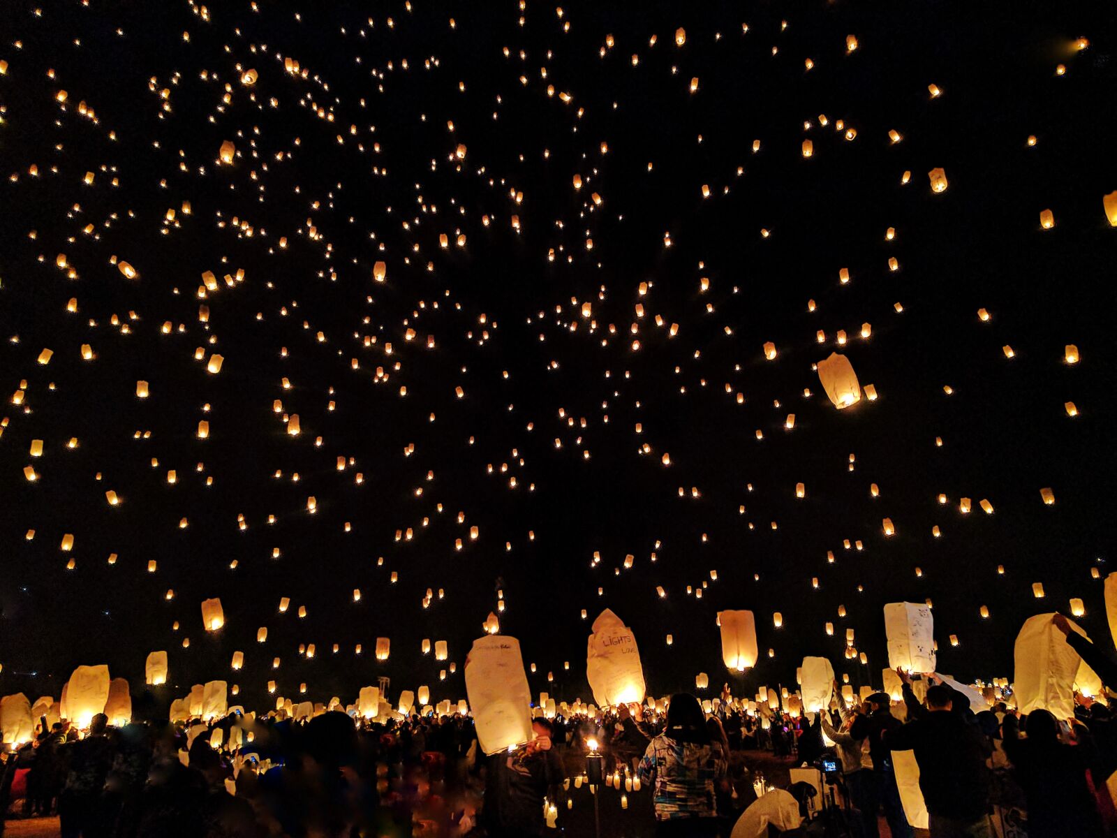 Google Pixel sample photo. Bright, celebration, crowd, dark photography