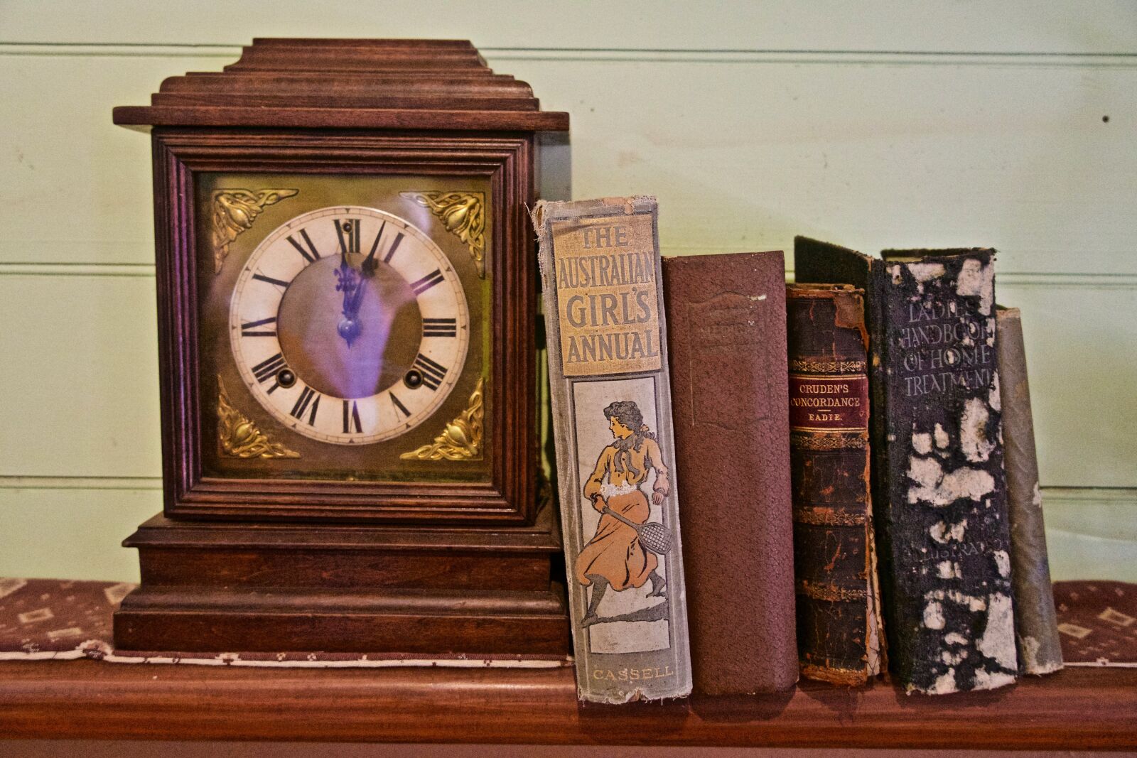 Sony E 18-135mm F3.5-5.6 OSS sample photo. Books, clock, antique photography