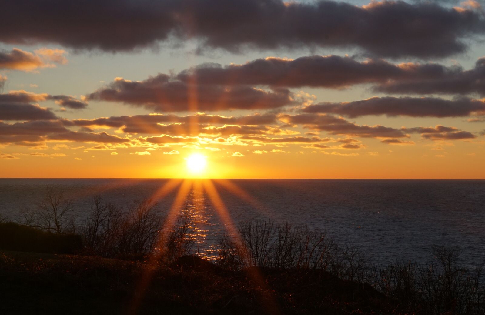 Sony FE 50mm F1.8 sample photo. Sunset, lake michigan, winter photography