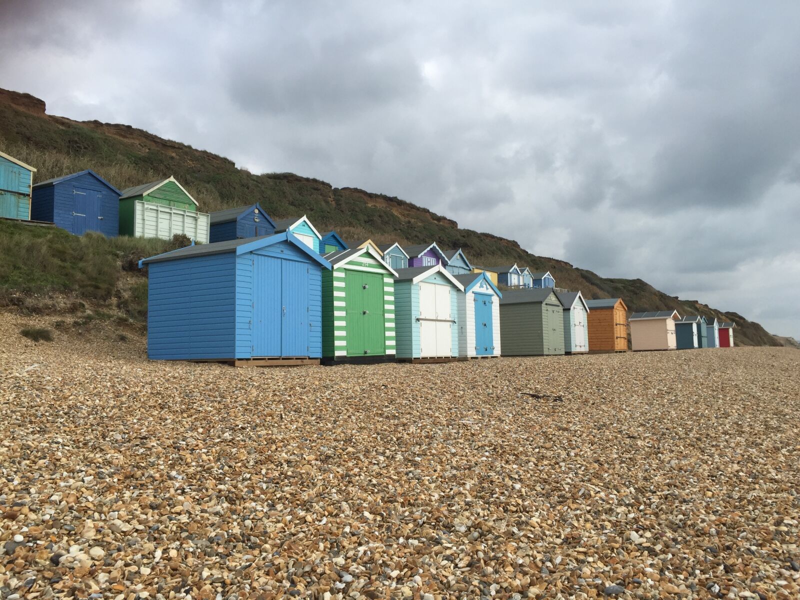 iPhone 6 Plus back camera 4.15mm f/2.2 sample photo. Beach huts, beach, pebbles photography