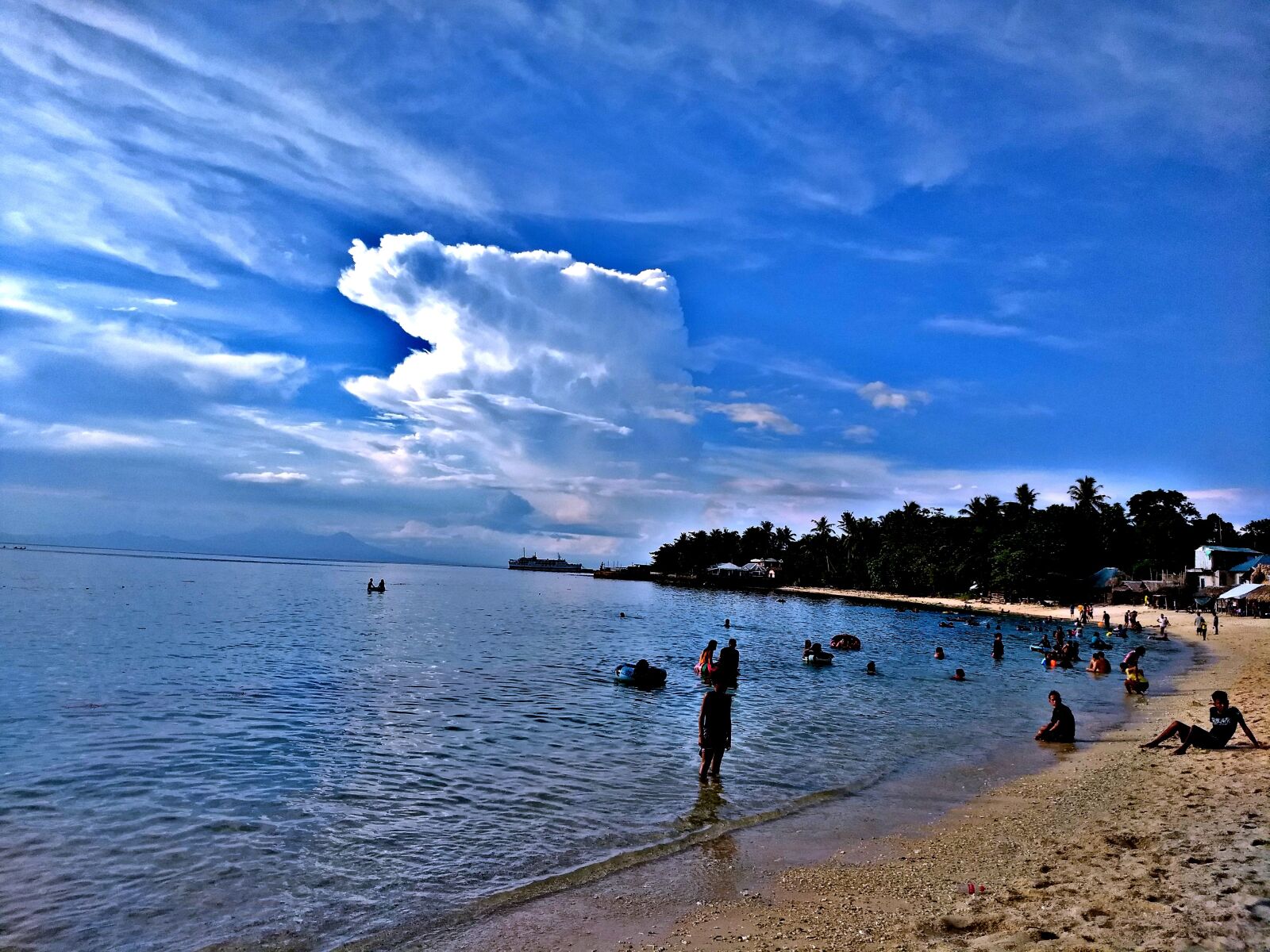 Motorola Moto G (5) Plus sample photo. Beach resort, cloudy, blue photography