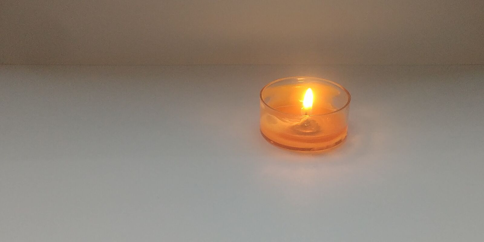 LG G6 sample photo. Candle, melt, orange photography