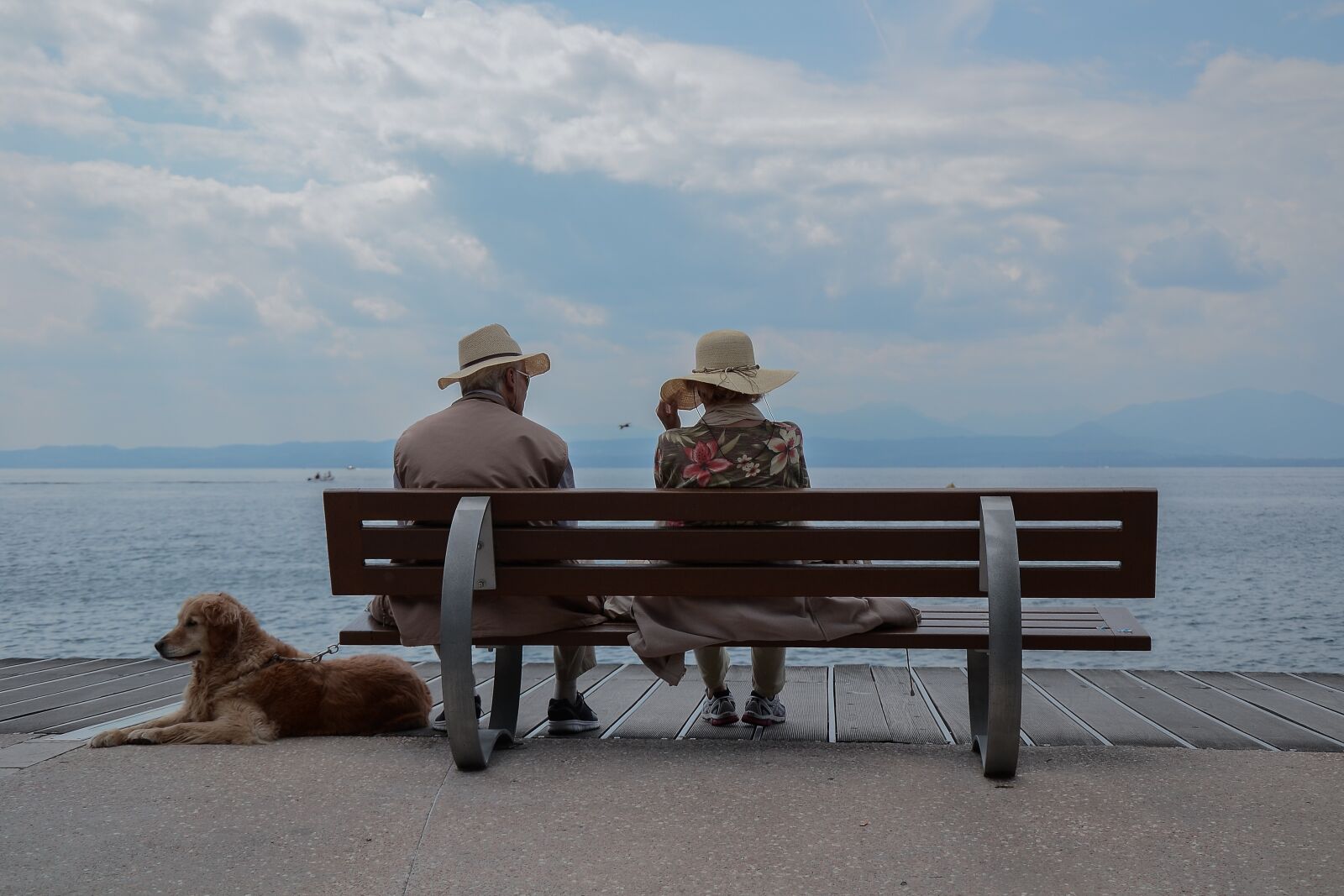Nikon D3100 sample photo. Bench, boardwalk, clouds photography