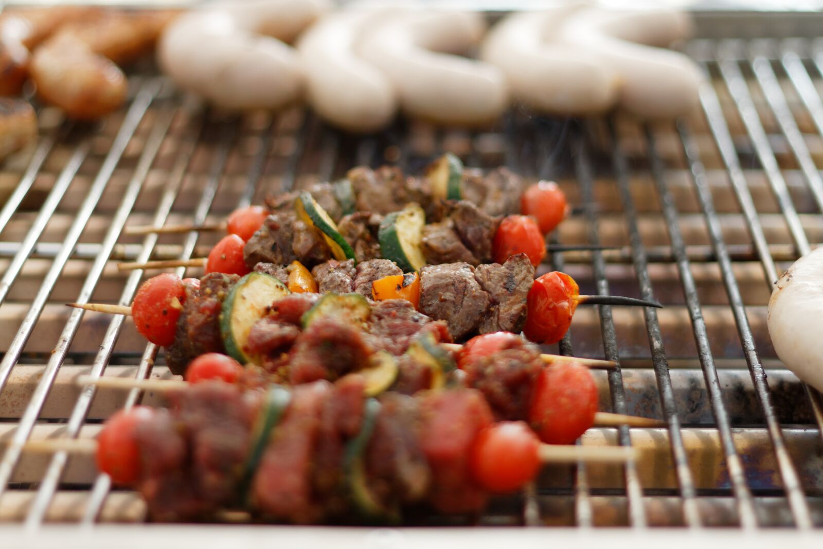 Canon EOS 7D + Canon EF 50mm F1.8 II sample photo. Skewers, barbecue, sausages photography