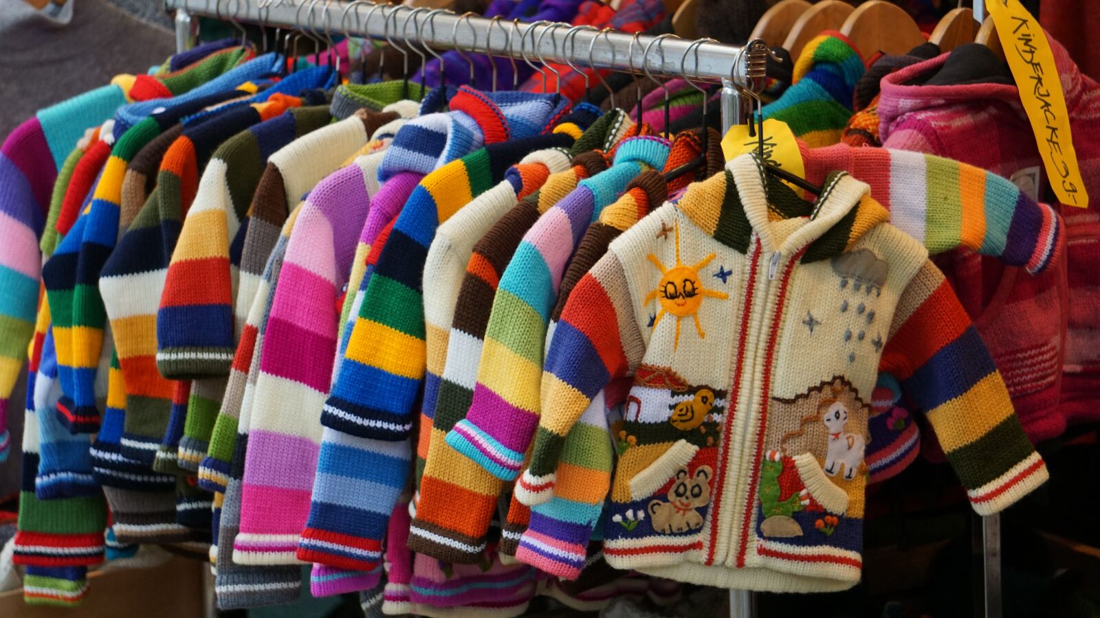 Sony a6000 sample photo. Children dresses, colored jackets photography