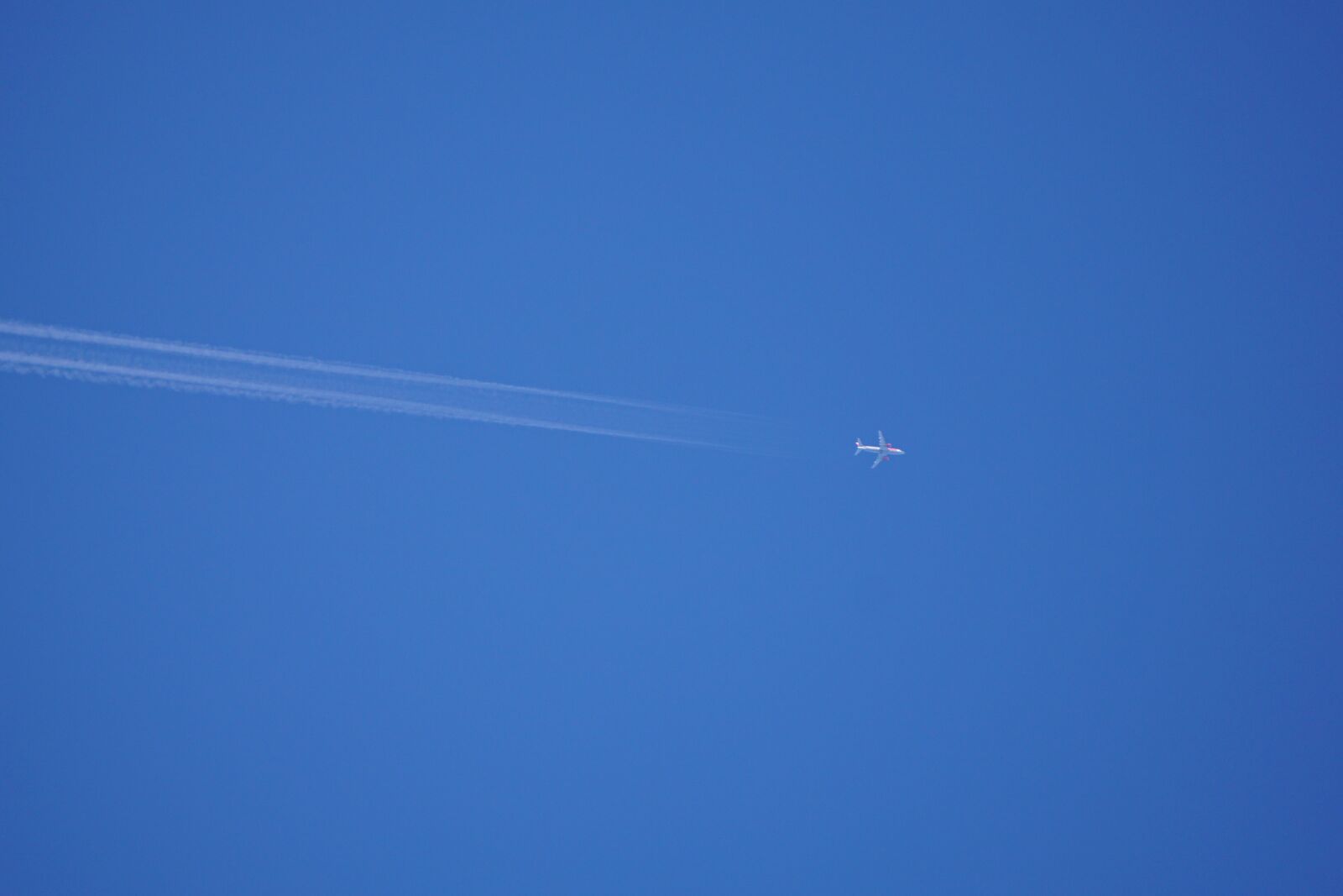 Sony E 55-210mm F4.5-6.3 OSS sample photo. Sky, blue, aircraft photography