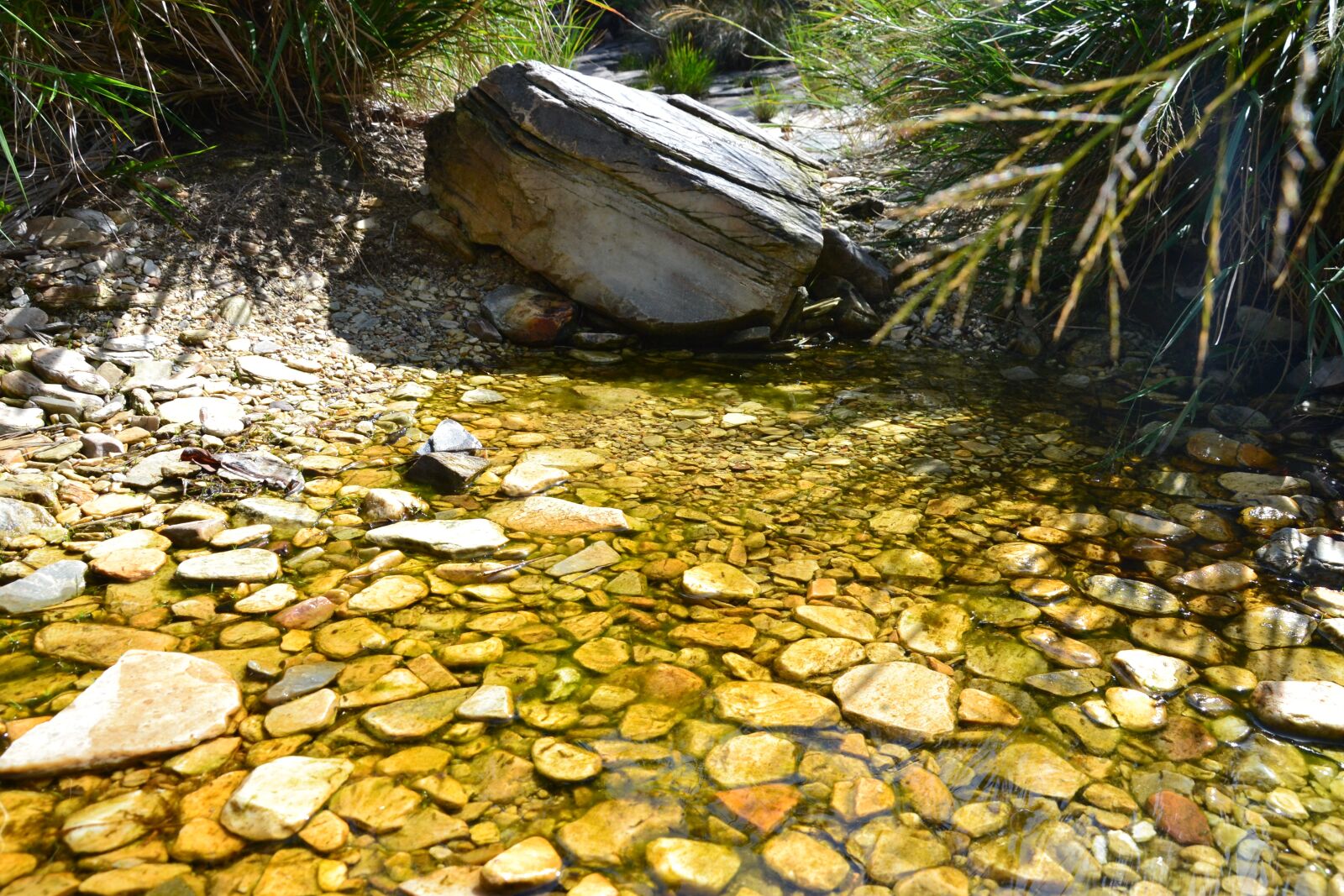 Nikon D3100 sample photo. Stones, rio, lake photography