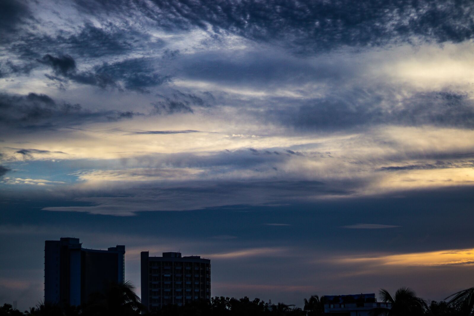 Canon EF 50mm F1.8 STM sample photo. Clouds, sky, buildings photography