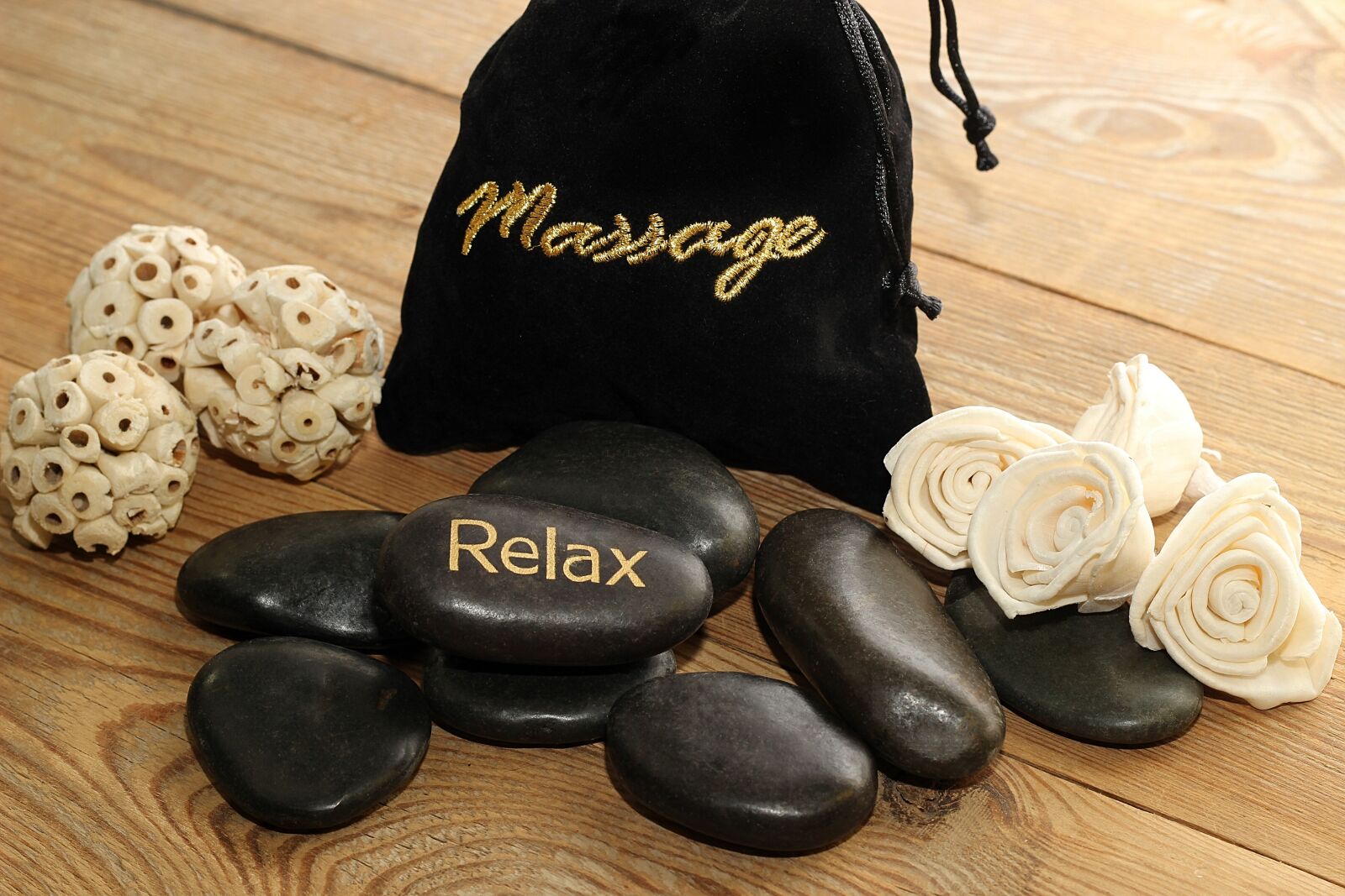 Canon EOS 600D (Rebel EOS T3i / EOS Kiss X5) + Canon EF 50mm F1.8 II sample photo. Massage, stones, black photography