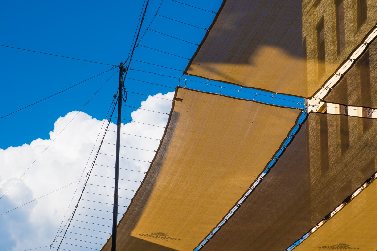Fujifilm XF 18-55mm F2.8-4 R LM OIS sample photo. Sky, clouds, awnings photography