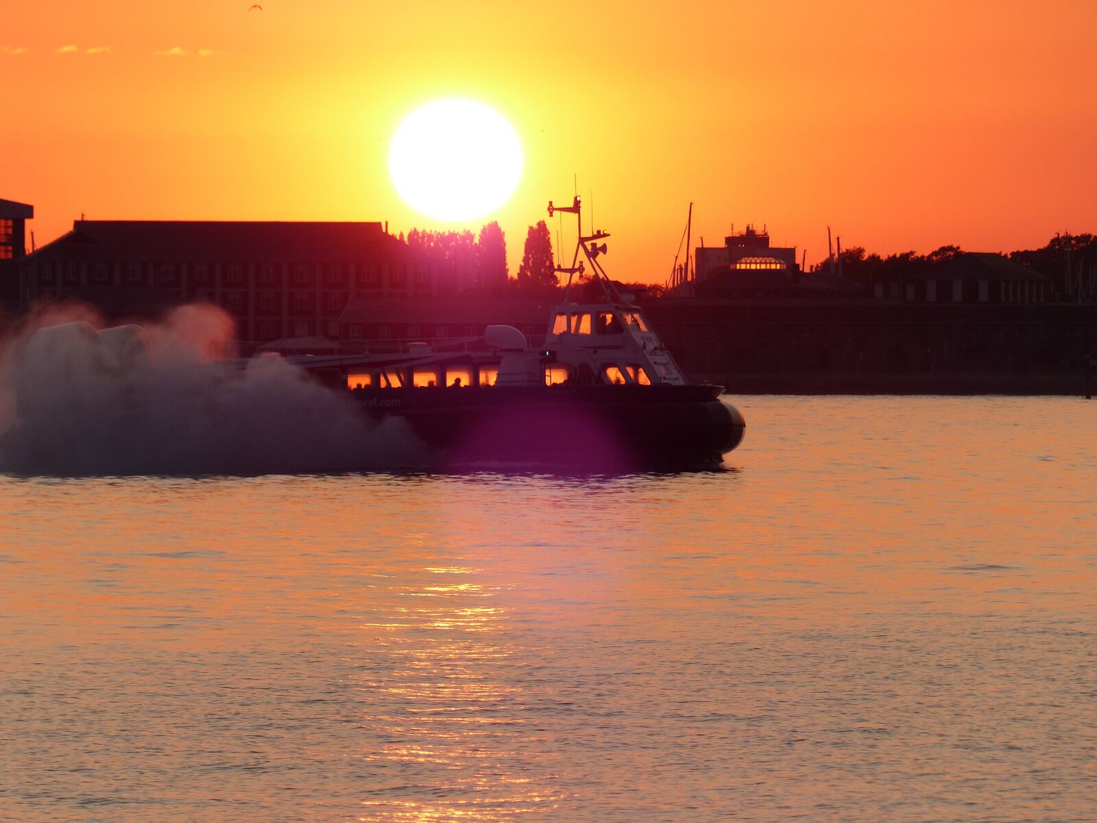 Panasonic Lumix DMC-FZ200 sample photo. Sunset, sea, hovercraft photography