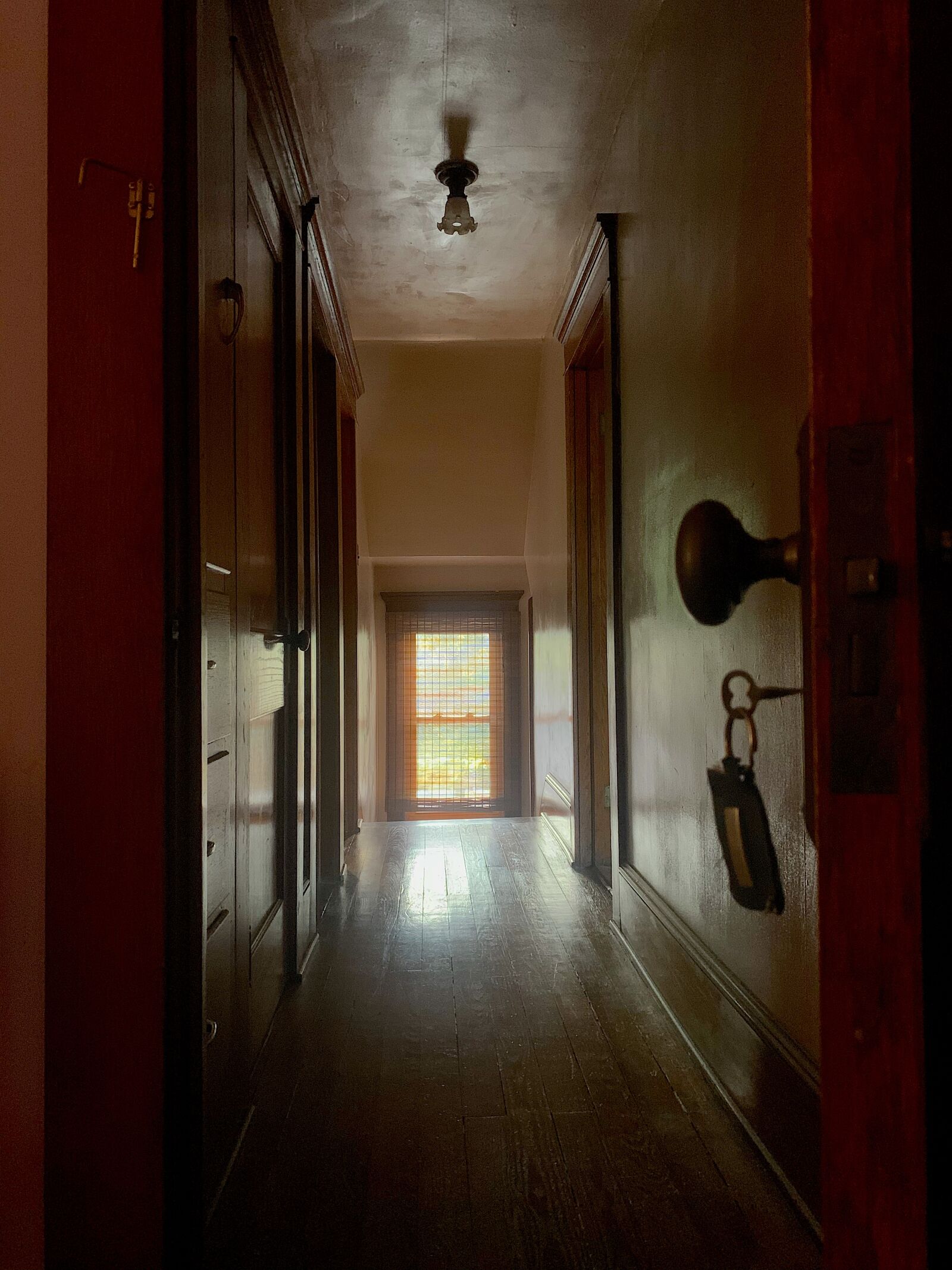 Apple iPhone XS Max sample photo. Doorknob, hallway, window photography