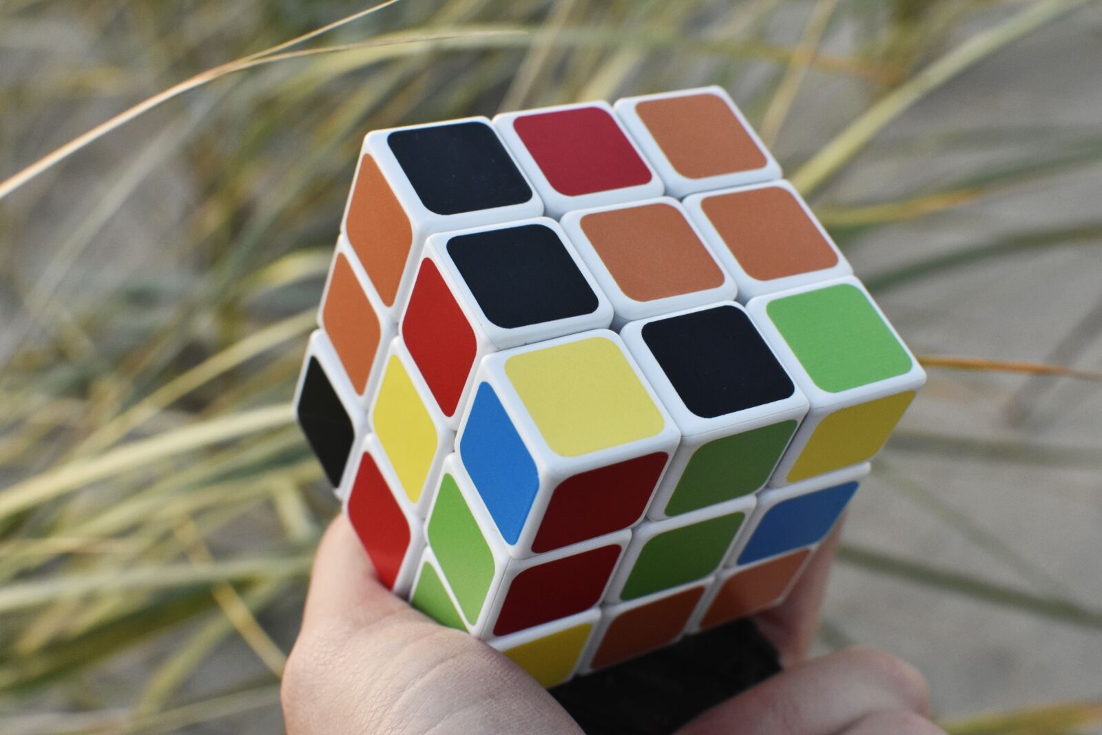 Nikon D7200 sample photo. Rubik cube, hand, outside photography