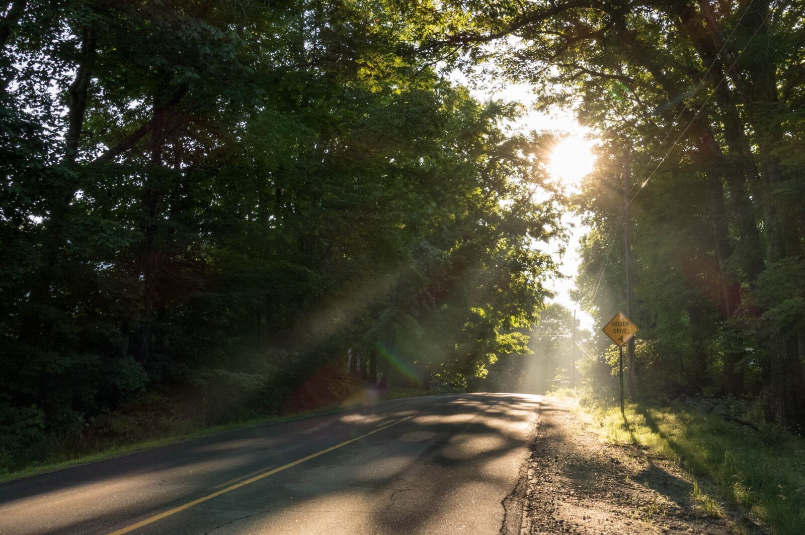 Panasonic Lumix DMC-FZ1000 sample photo. Rural road, sunbeams, crepuscular photography
