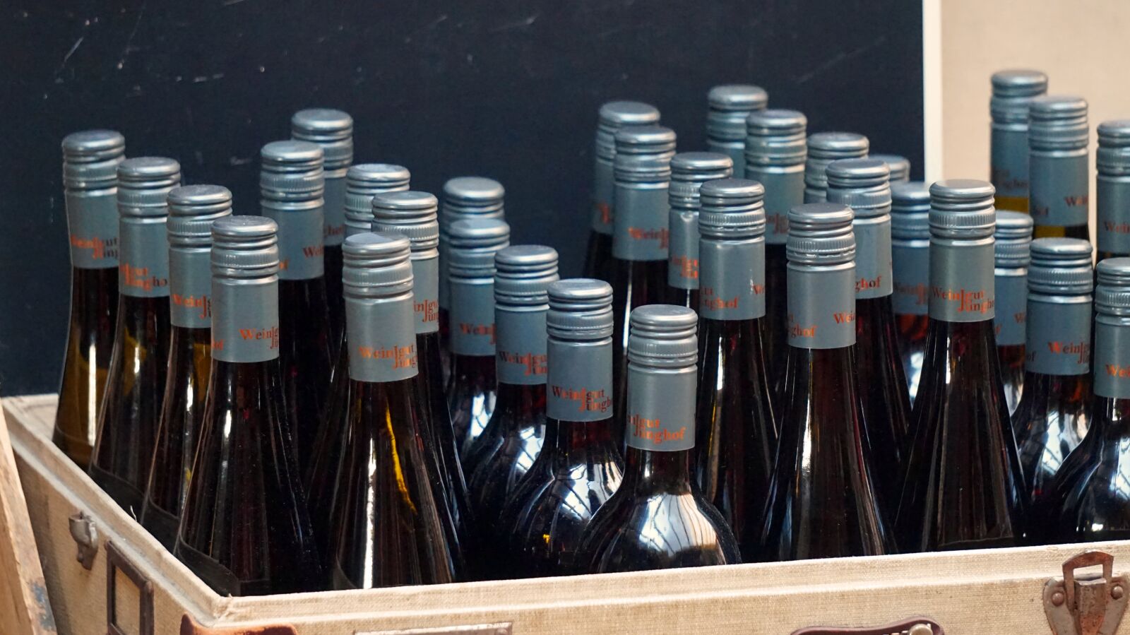 Sony Alpha a5000 (ILCE 5000) + Sony E 55-210mm F4.5-6.3 OSS sample photo. Wine, bottles, box photography
