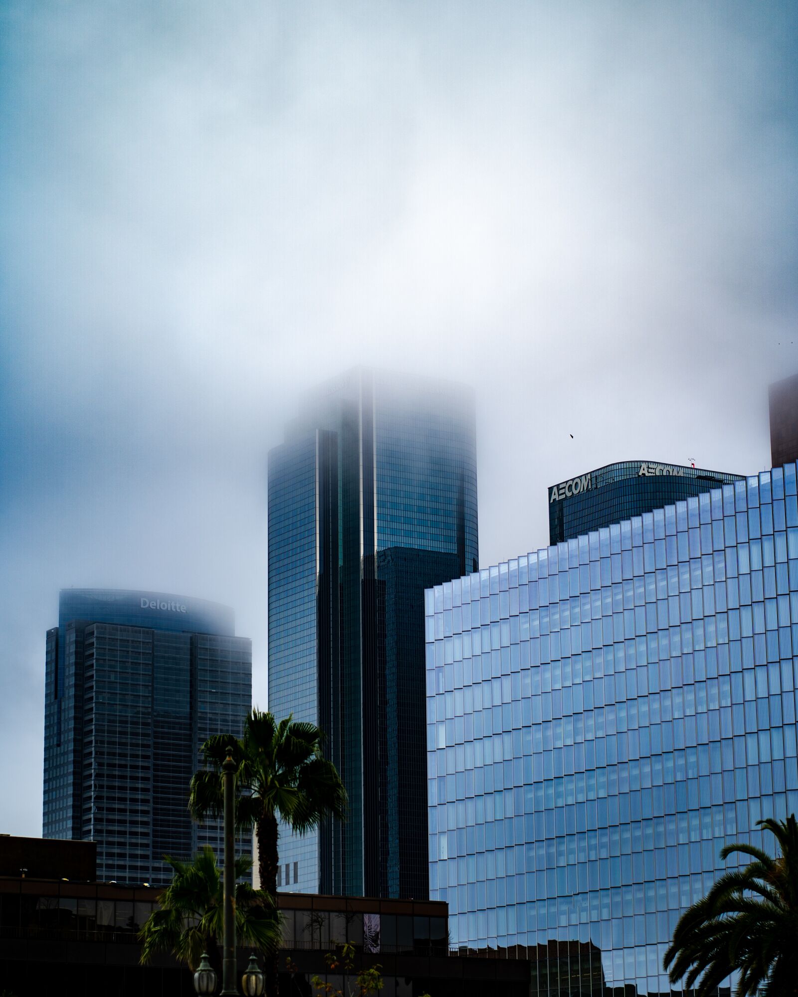 Sony a7 III + Sony FE 85mm F1.8 sample photo. Skyscraper, rainy, cloudy photography