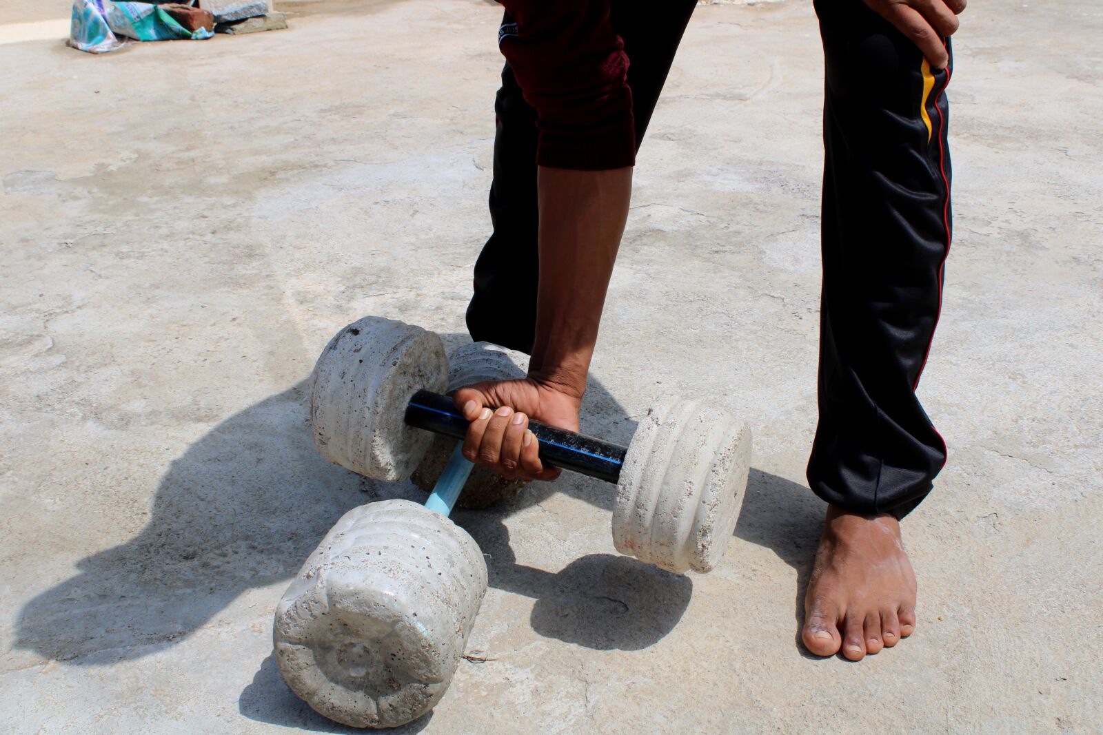 Canon EOS 2000D (EOS Rebel T7 / EOS Kiss X90 / EOS 1500D) sample photo. Village gym equipment, cement photography