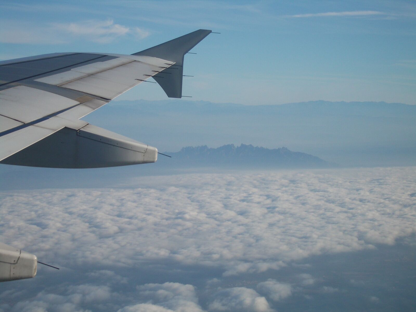 Pentax OPTIO S5I sample photo. Montserrat from plain, clouds photography