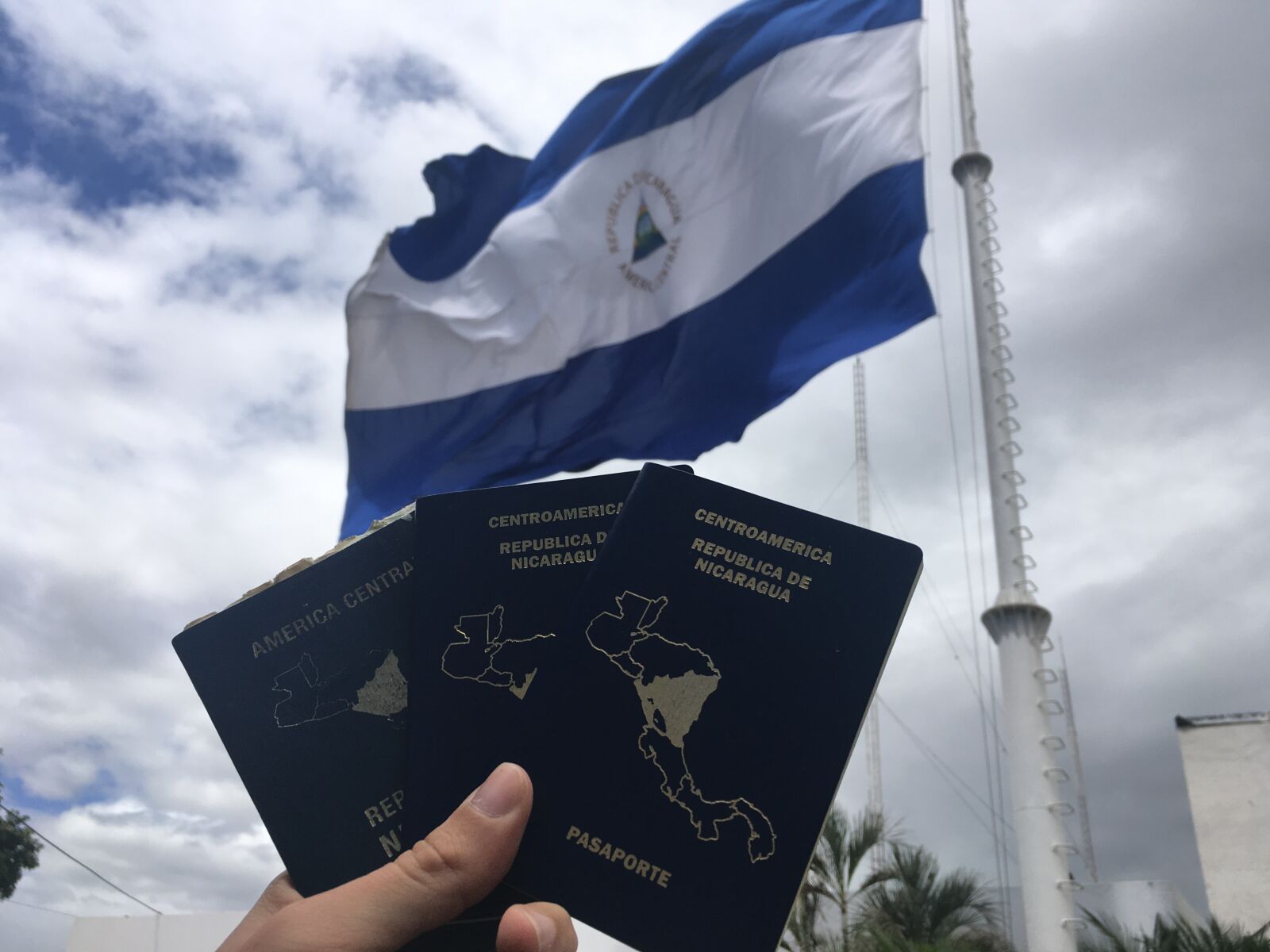 iPhone SE back camera 4.15mm f/2.2 sample photo. Nicaragua, passports, flag migration photography