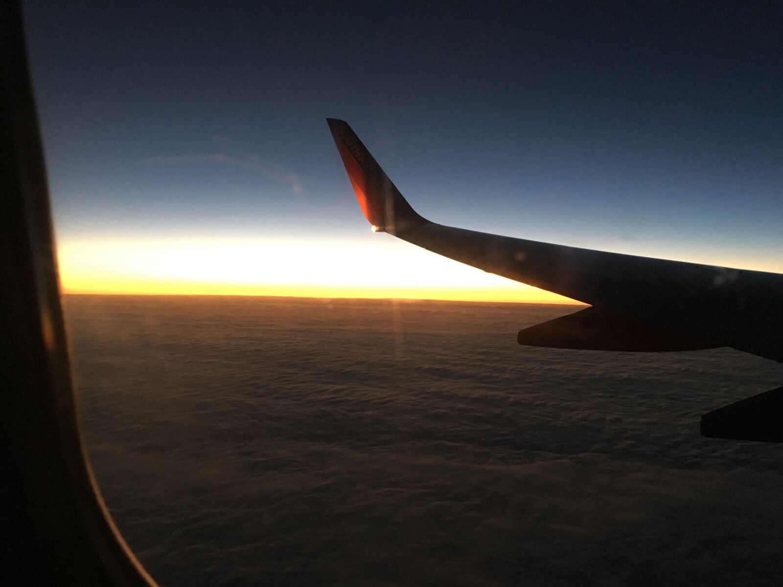 Apple iPhone 6s sample photo. Plane, window seat, sunset photography