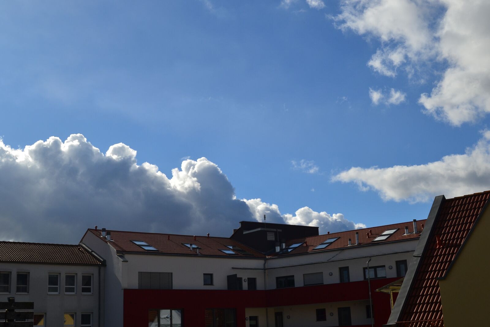 Nikon D3100 sample photo. House roofs, sky, blue photography