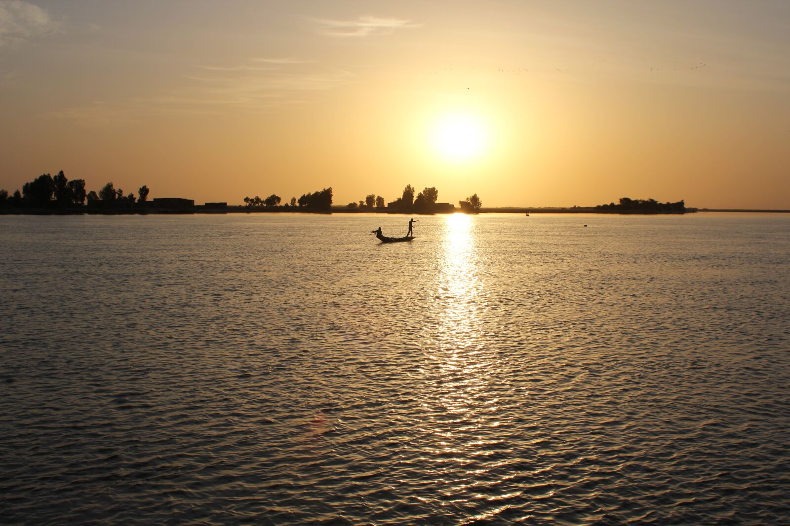 Canon EOS 60D + Canon EF 28mm F1.8 USM sample photo. Sunset, africa, fisherman photography