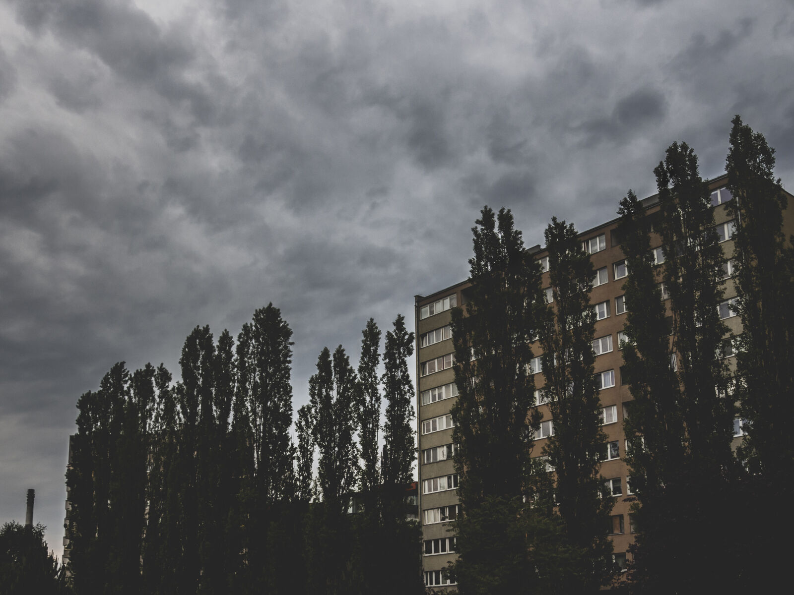 Olympus OM-D E-M5 sample photo. Bad, clouds, dark, houses photography