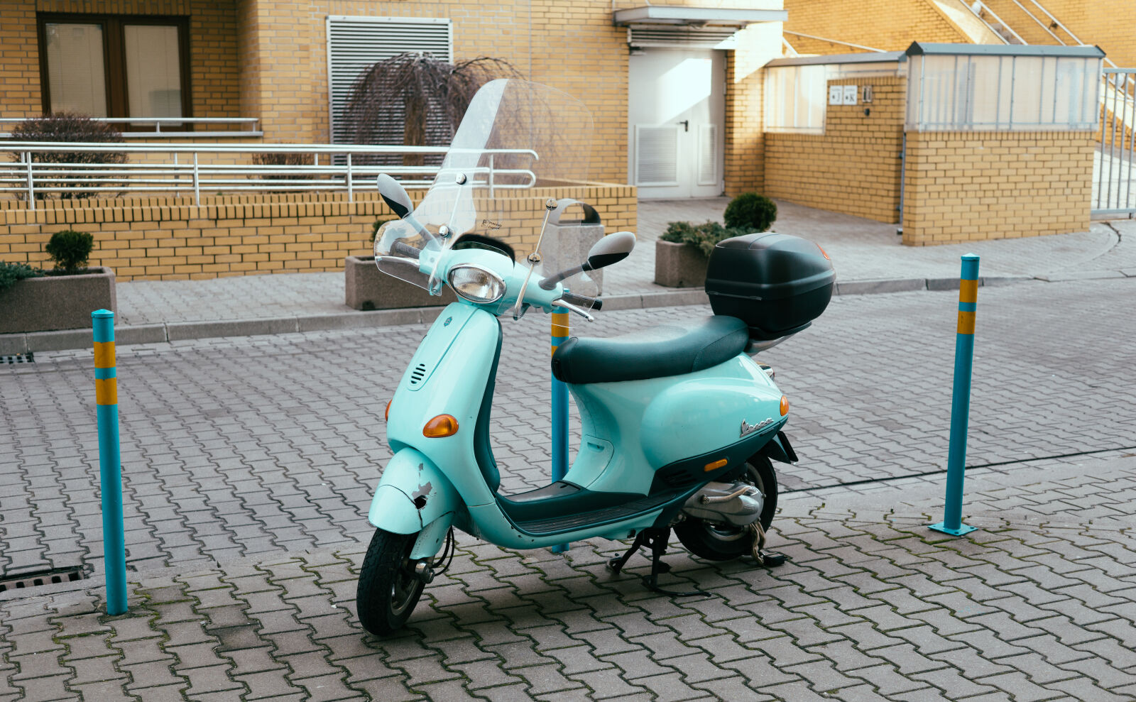 Sony a6000 + Sigma 30mm F2.8 EX DN sample photo. Aqua, blue, moped, parking photography