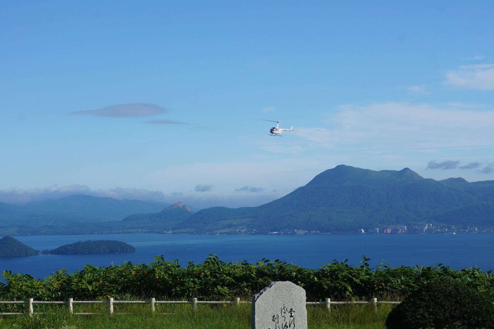 Sony a6000 sample photo. Lake toya, summer, helicopter photography